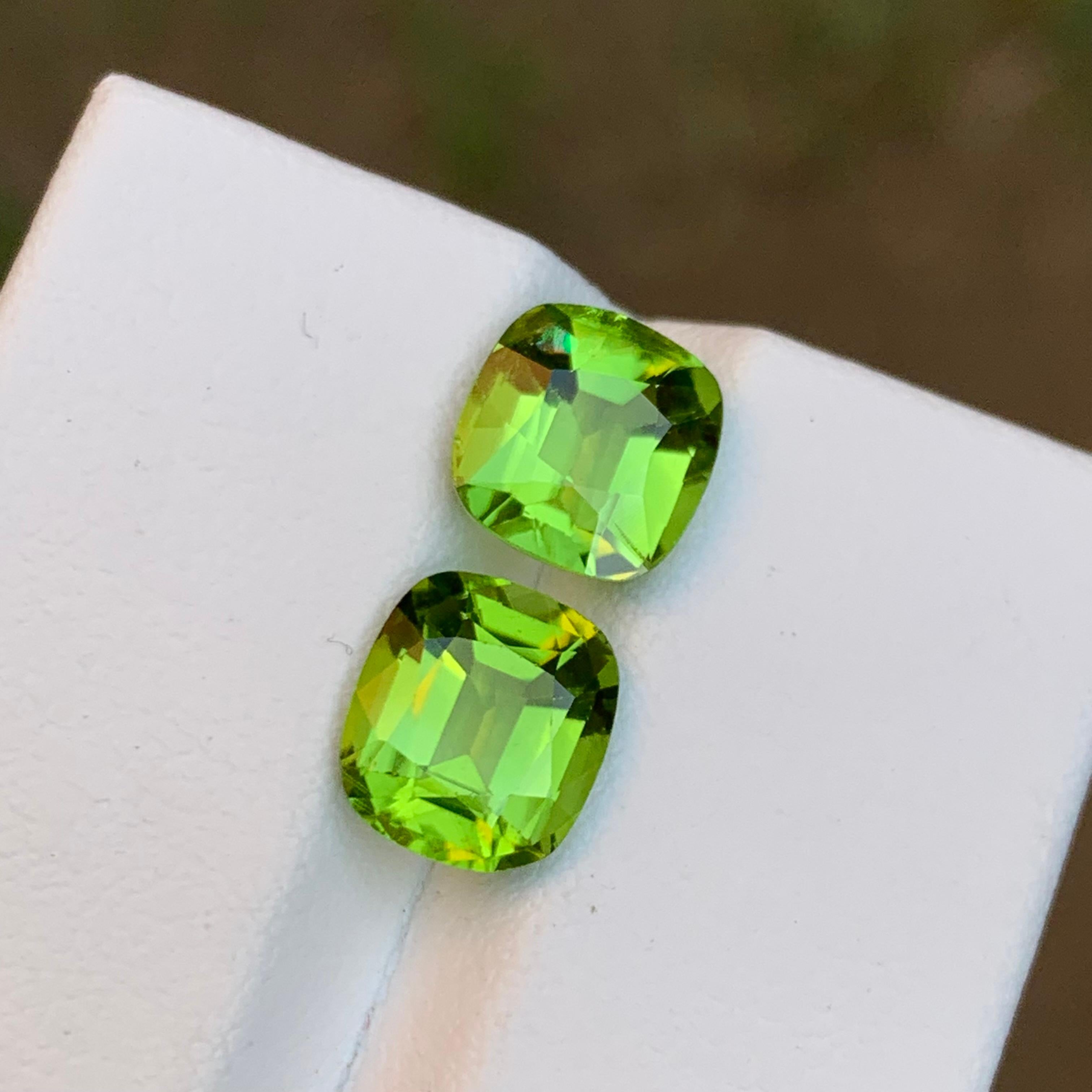 Introducing our exquisite Magnificent Green Peridot Gemstones sourced from the renowned Supat Mine in Pakistan, celebrated for yielding some of the world's finest peridots. The cushion cut showcases the vibrant green hue, complemented by brilliant