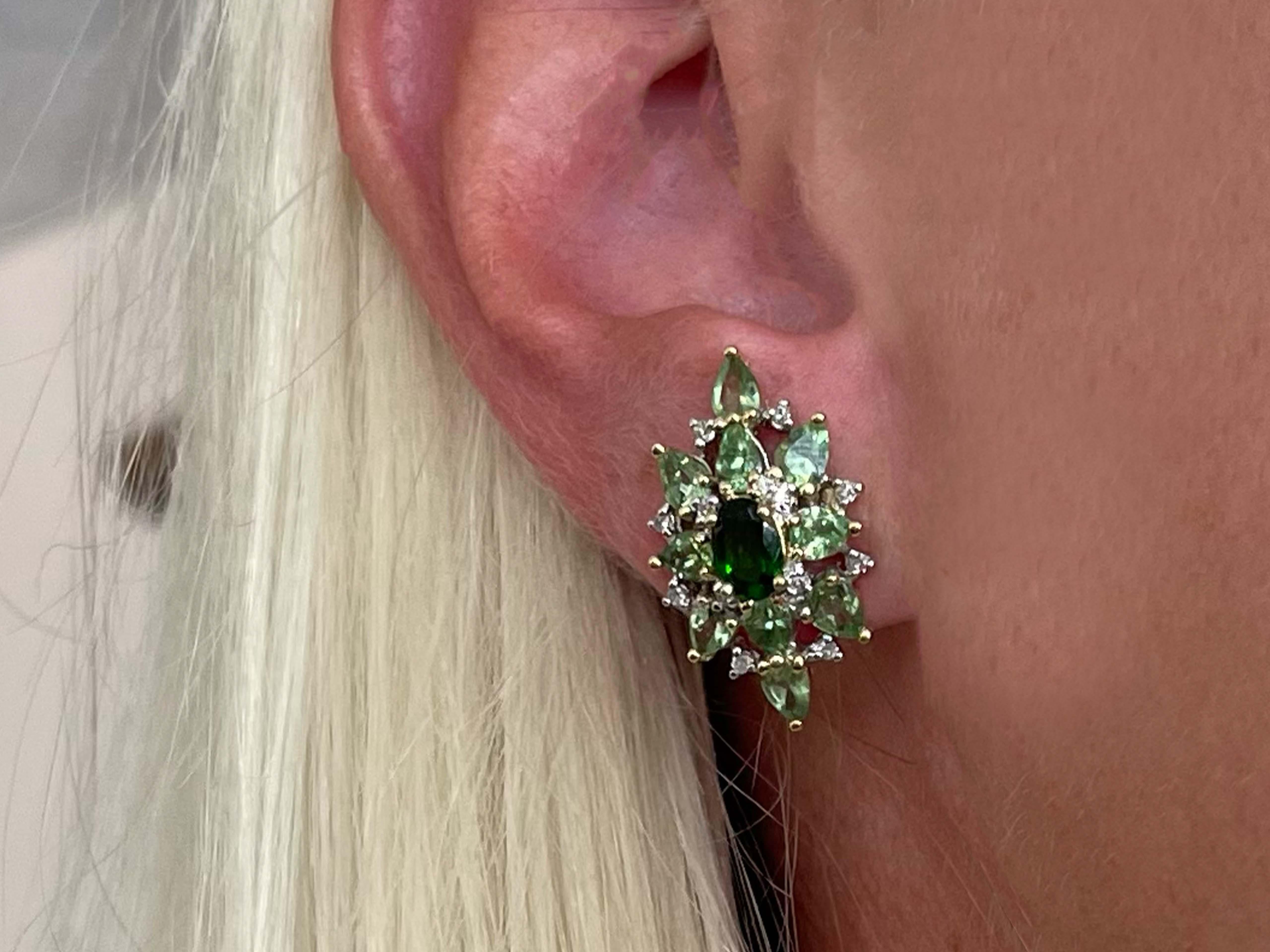 Specifications:

Metal: 10k Yellow Gold

Total Weight: 4.7 Grams
​
​Green Peridot Count: 20  pear shaped 
​
​Green Garnet Count: 2 oval shaped
​
​Diamond Carat Weight: 0.10
​
​Diamond Count: 24 round single cut
​
​Diamond Color: H-I
​
​Diamond