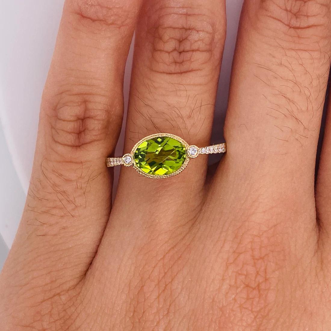Modern Green Peridot Ring w Oval Peridot Set East to West with Diamonds in 14 KT Yellow For Sale
