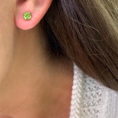 Green peridot solitaire stud earrings yellow gold