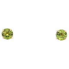 Green peridot solitaire stud earrings yellow gold