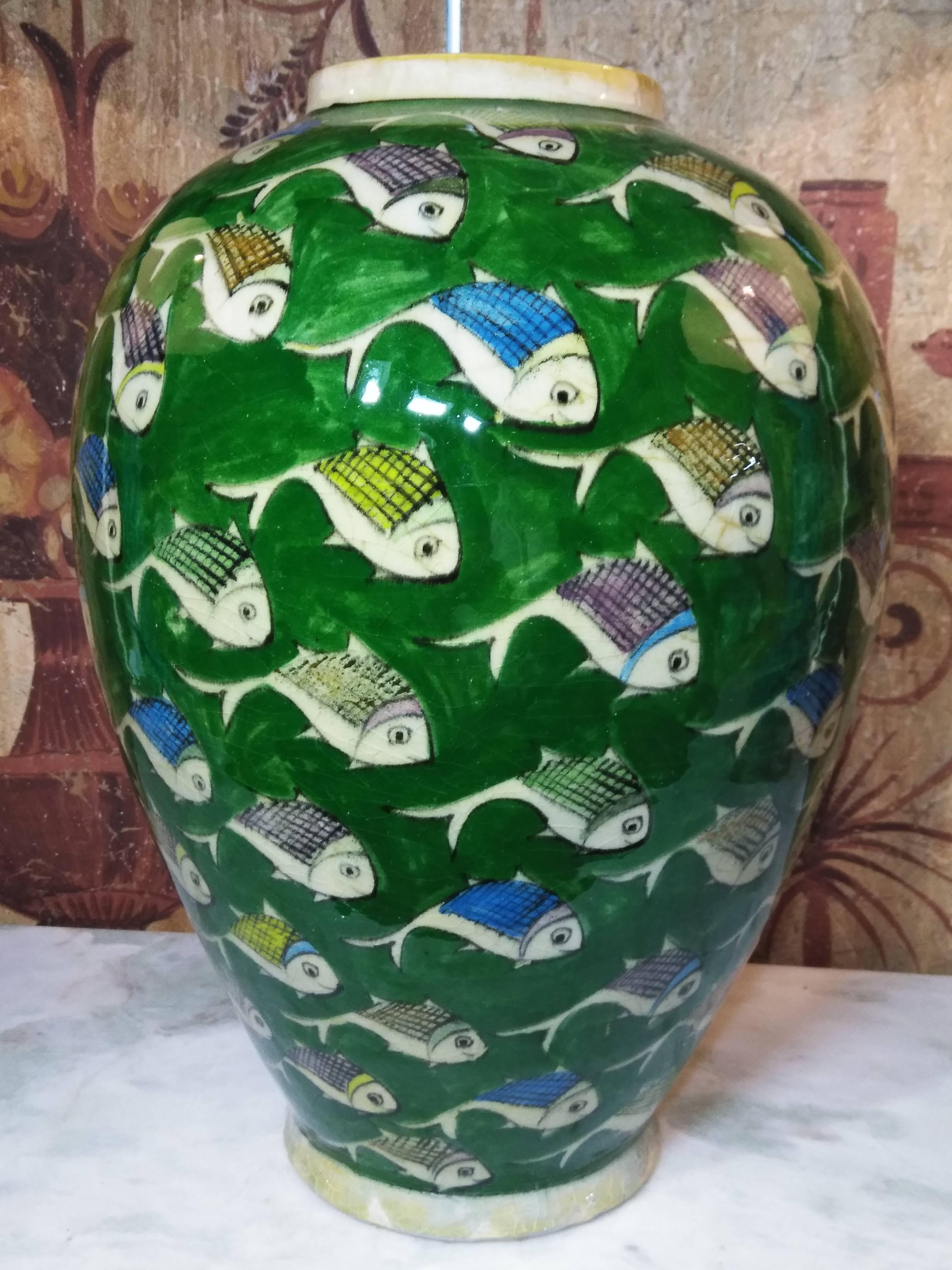 Beautiful vintage green Persian ceramic vase with hand-painted colorful fish motif surrounding it. Great decorative piece of art for any room.