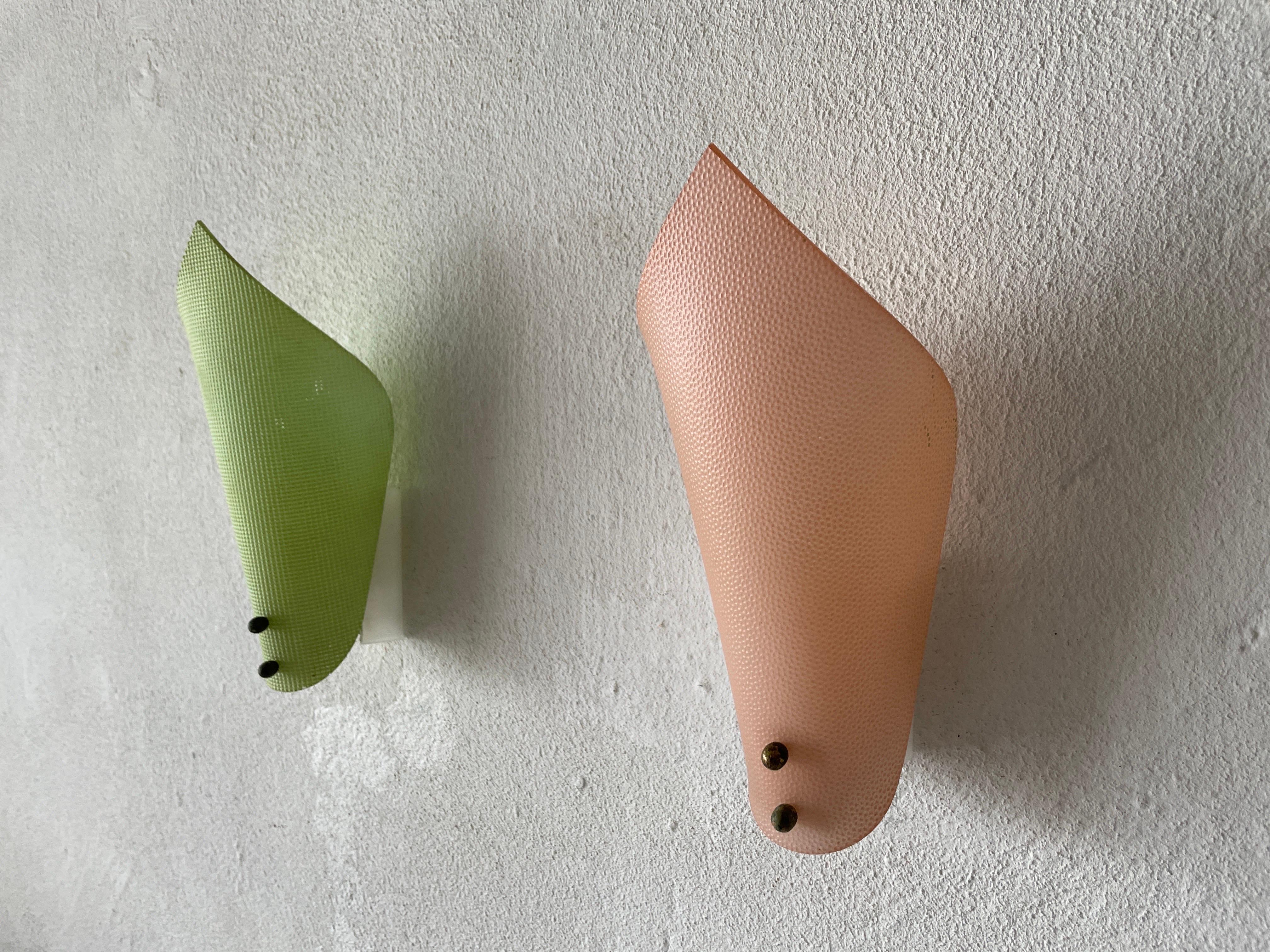 Green & Pink Plexiglass Leaf shaped Pair of Sconces, 1950s, Germany

Very elegant and Minimalist wall lamps.

Lamps are in very good condition.

These lamps works with E14 standard light bulbs. Each lamp works with 1 light bulb. Max 40
