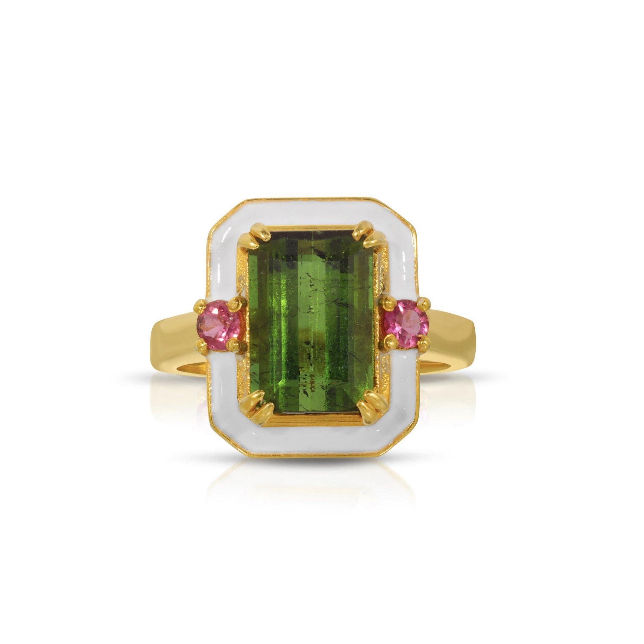 A beautiful cocktail ring of modern design with mixed-cut Tourmalines and enamel. This gorgeous ring features an alluring emerald cut Dark Green Tourmaline center stone set with two round cut fiery Pink Tourmalines and glossy white enamel. This ring
