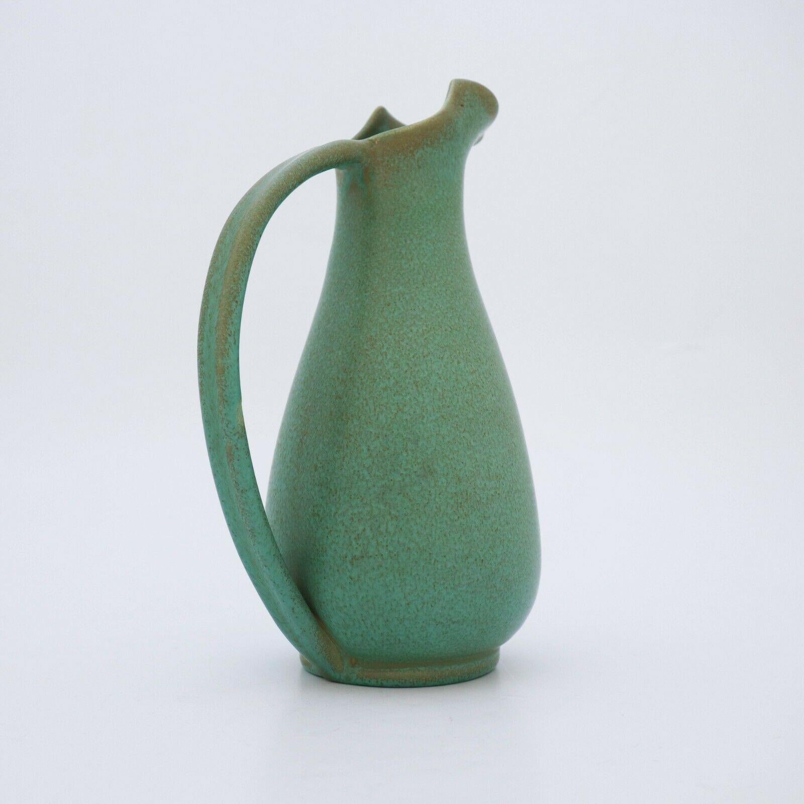 A lovely pitcher designed by Ewald Dahlskog in the 1930s at Bo Fajans in Gefle, Sweden. It is 26.5 cm high and in perfect condition.