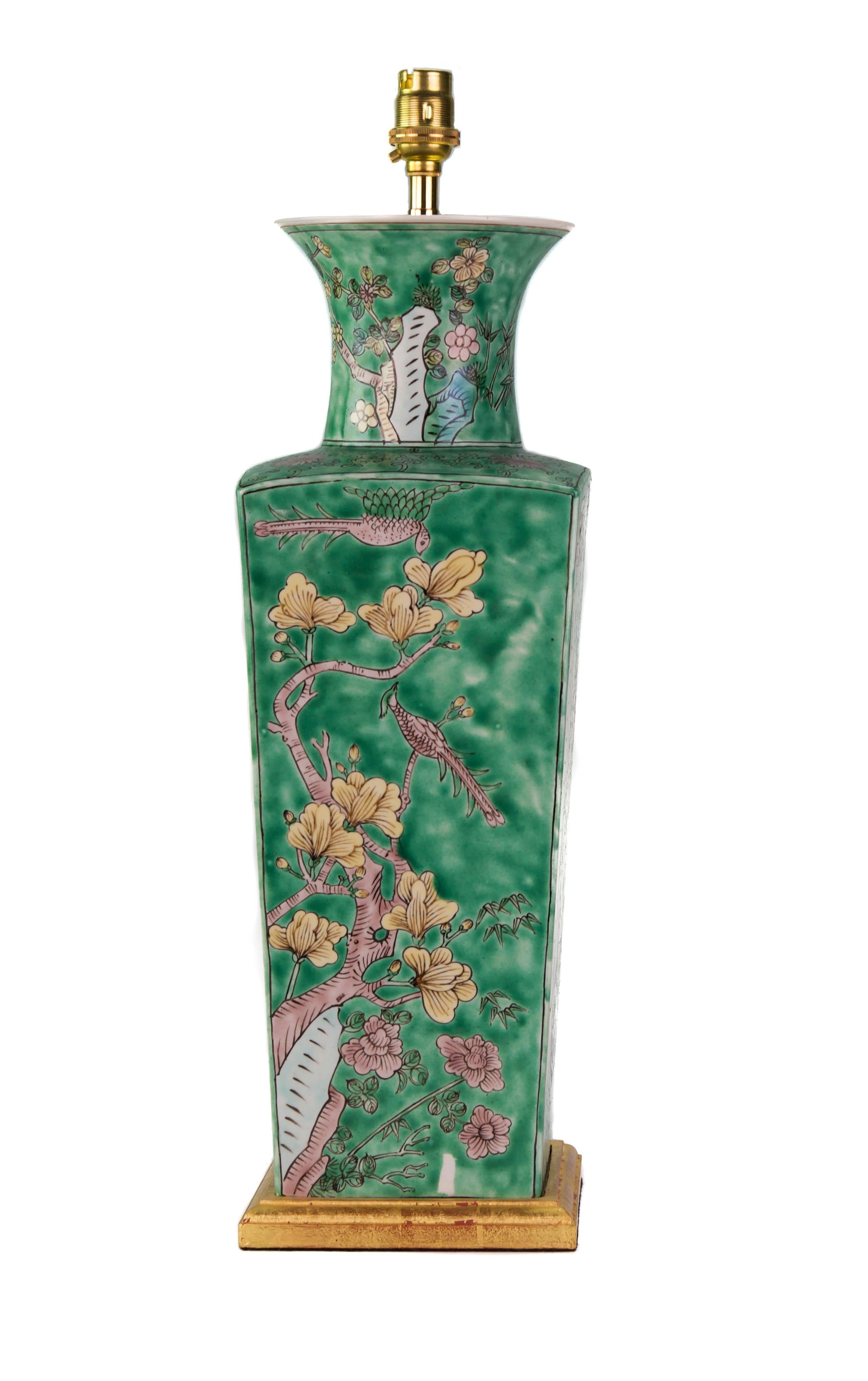 A fine 19th century French Samson of Paris vase decorated in the Kangxi style, finely painted throughout with blossoms and butterflies on a green ground, now mounted as a lamp with a hand-gilded turned base.

Measures: Height of vase 16 1/8 in (41