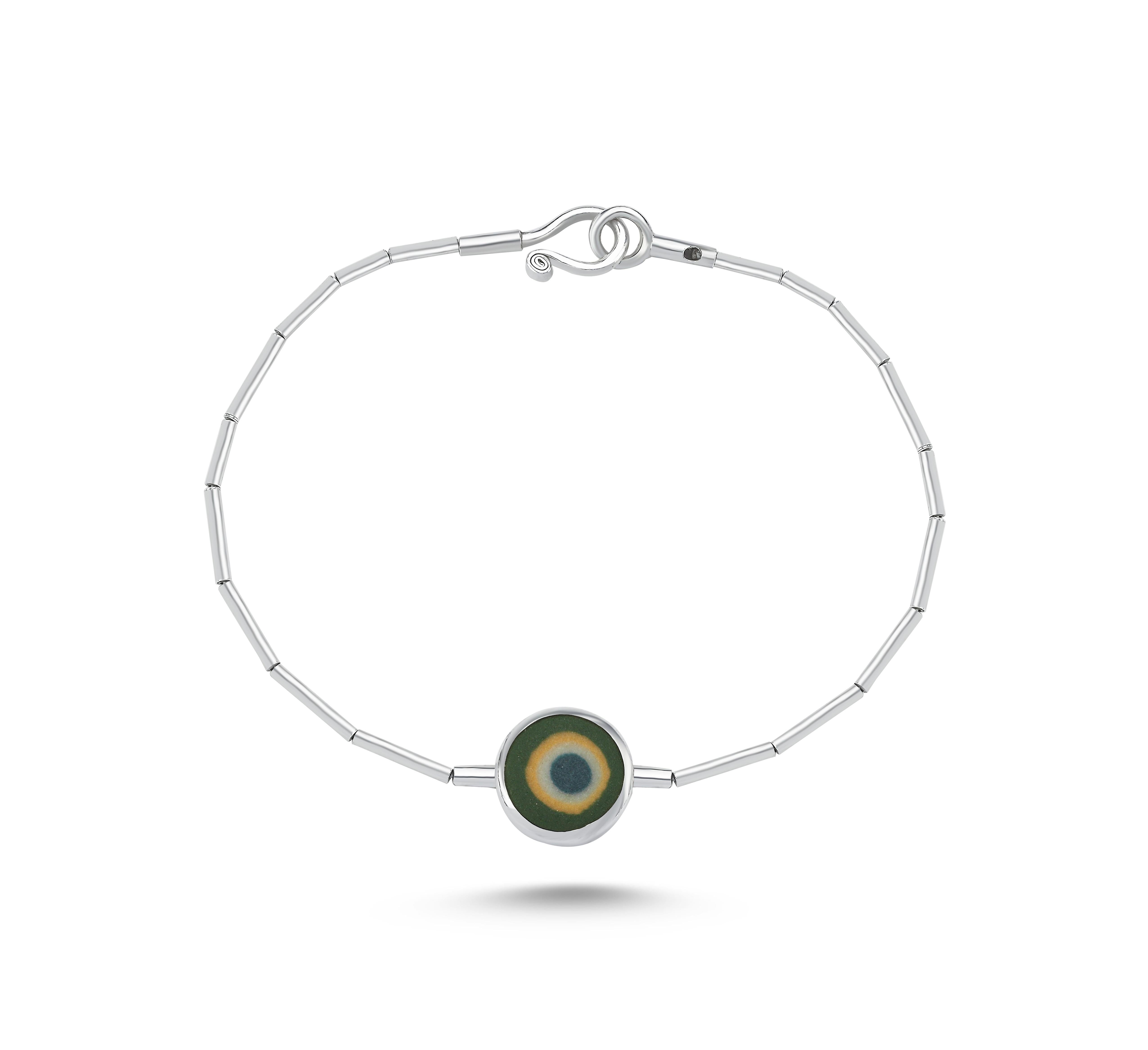 Evil Eye Bead made from porcelain. Sterling Silver. You can choose this design as a bracelet or necklace. Feel free to contact us.
Other color options are blue, green, orange, turquoise. We also have different shapes. Do not hesisate to ask your