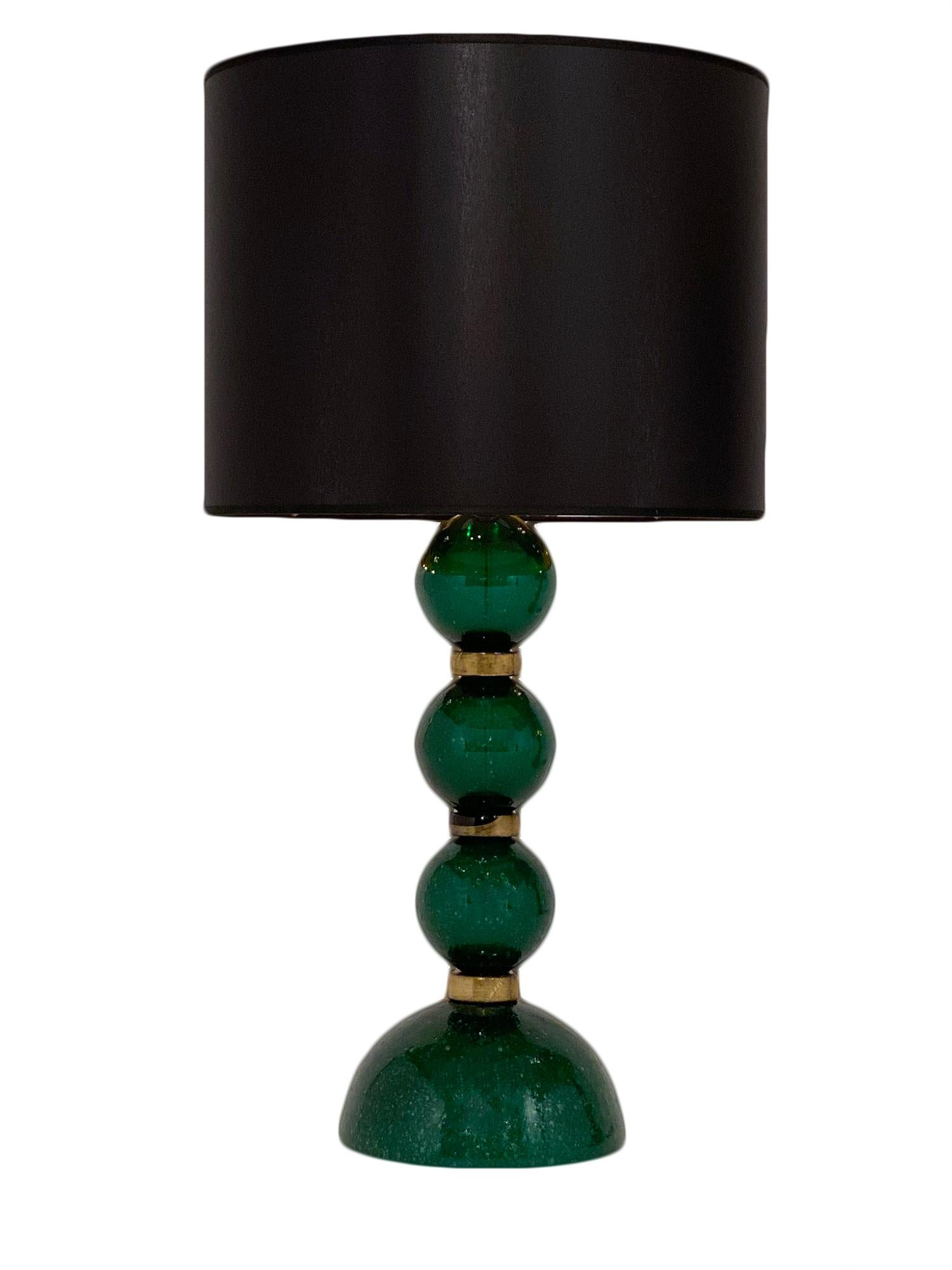 Murano glass green Pulegoso lamps signed by Alberto Donna, Murano. This pair is hand blown using the Pulegoso technique. We love the unique color and affect. This pair has been newly wired to fit US standards.