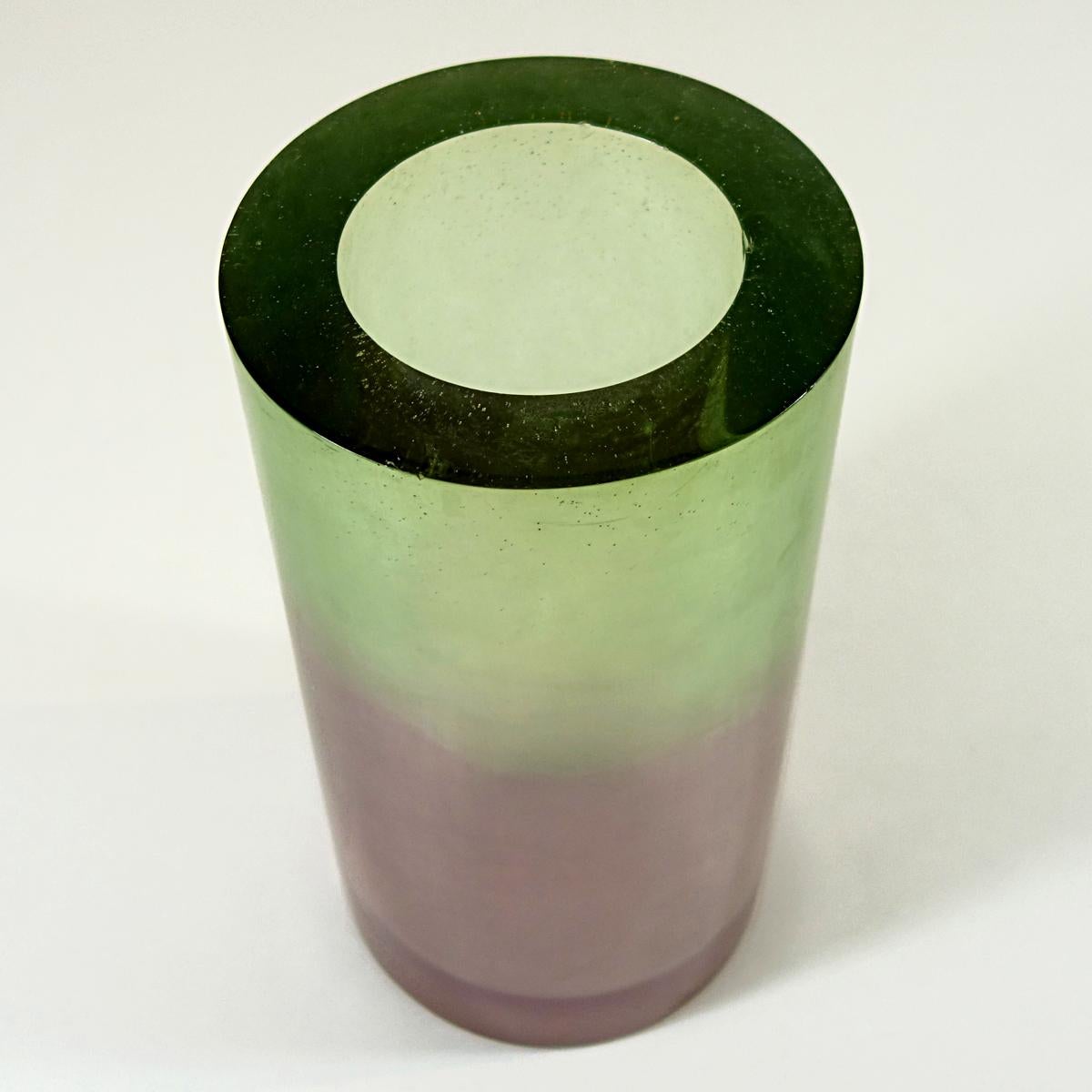 This vase is made of resin and fiberglass by American artist Steve Zoller. He is unique in his use of color, elemental shapes and flamboyant style. In 1993 he made this beautiful vase together with a floor lamp, a table lamp, a sconce and another