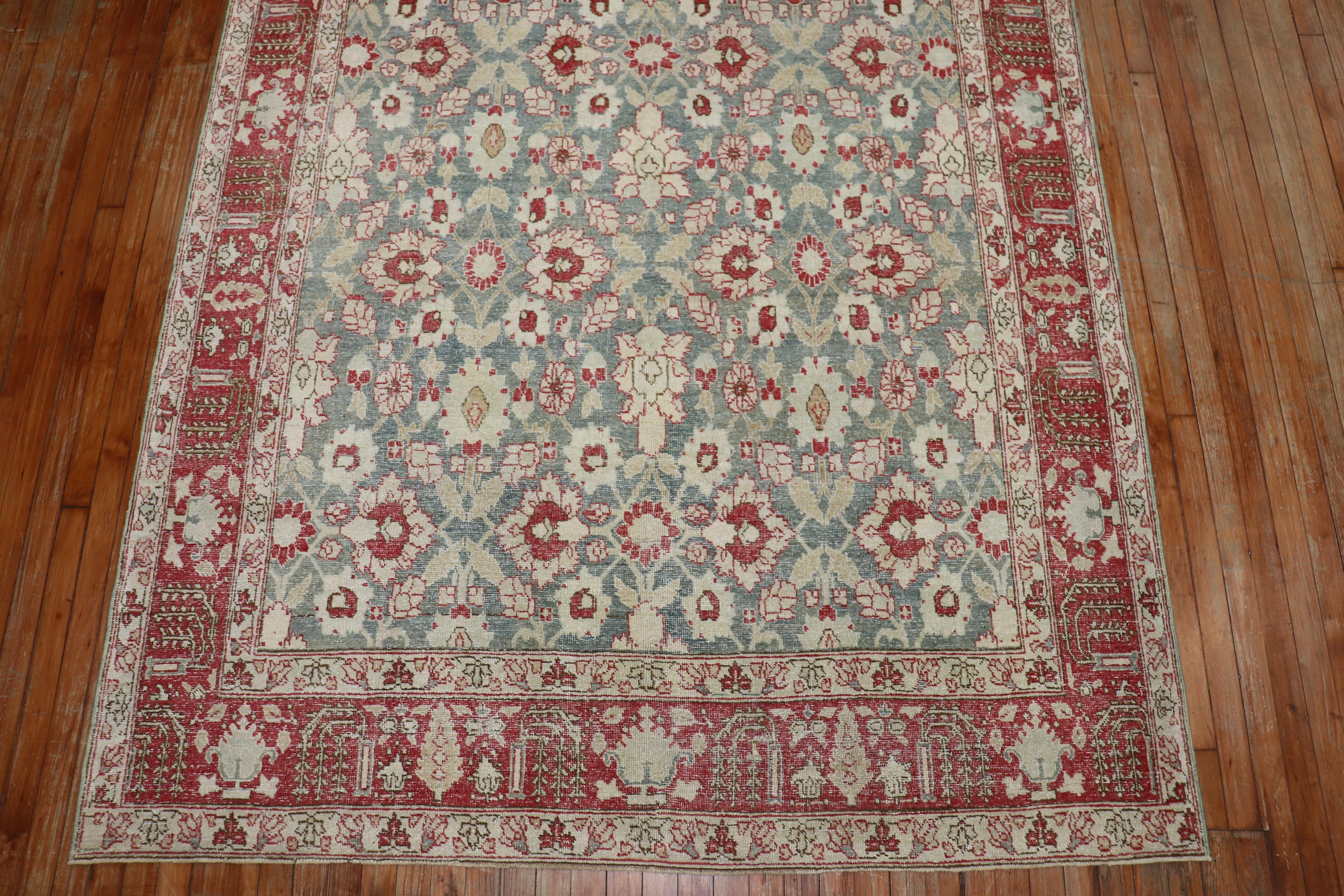 A room-size antique Persian Tabriz rug woven from the early 20th century. 

Measures: 6'3'' x 9'10''.
  
 