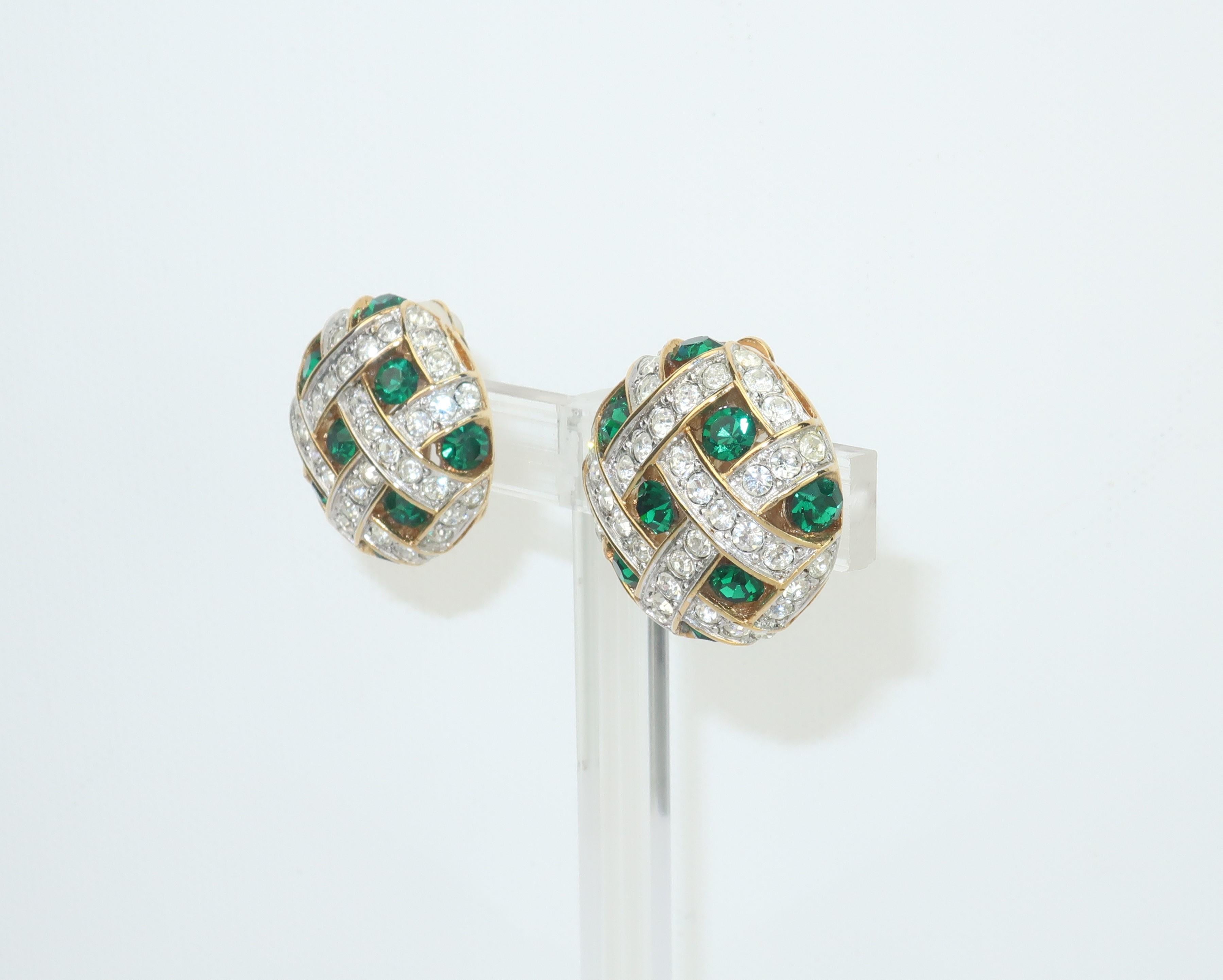 A beautiful pair of round green and crystal rhinestone earrings with a gold tone lattice style setting.  The clip on hardware includes rubber pads.  No apparent hallmark though well made with quality details.
CONDITION
Very good condition with some
