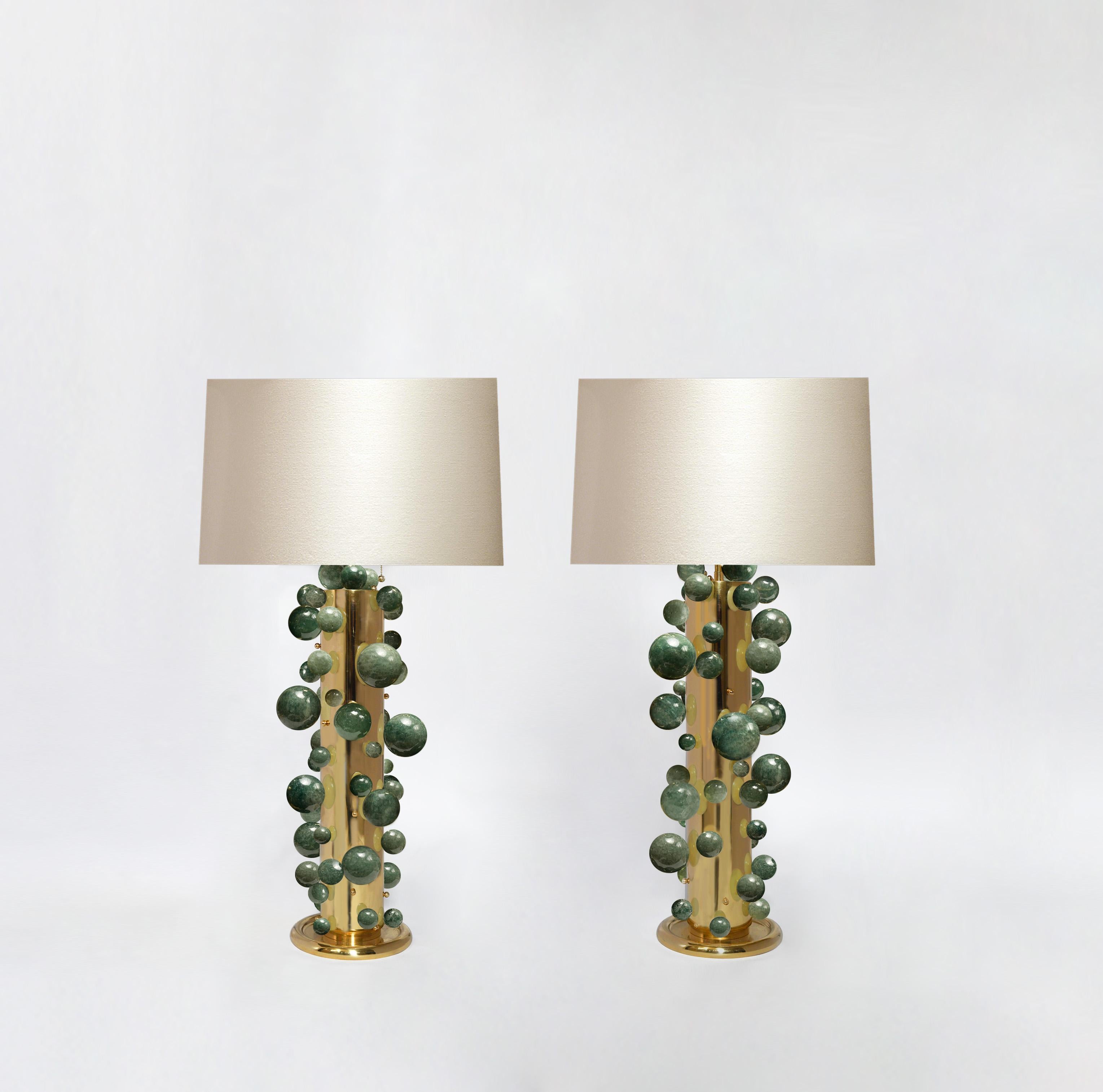 A tall pair of luxury green rock crystal quartz bubble lamps with polish brass frames. Created by Phoenix Gallery, NYC.
Each lamp installed two sockets.
To the top of the rock crystal 25.75
