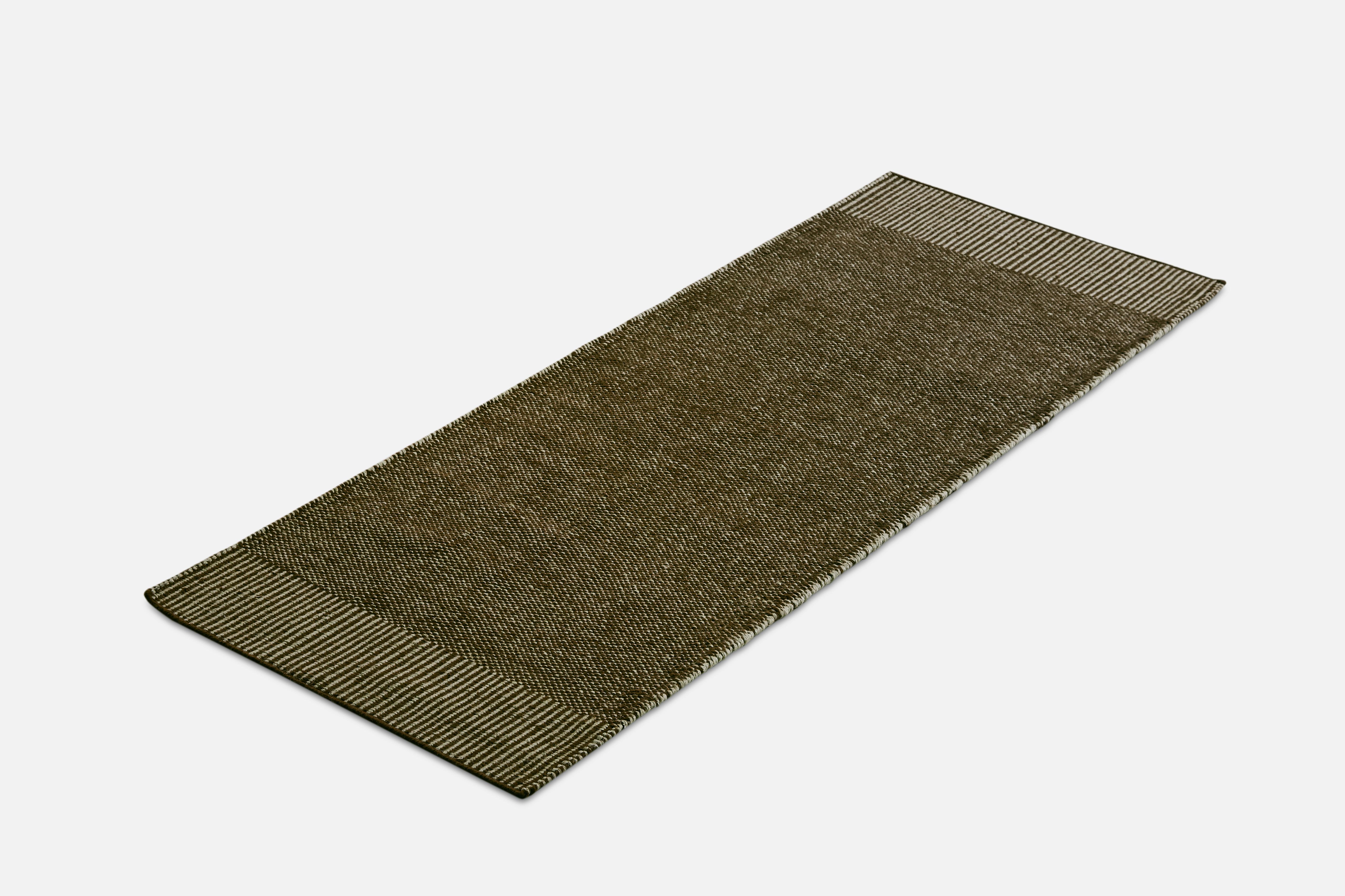 Green Rombo runner rug by Studio MLR.
Materials: 65% wool, 35% jute.
Dimensions: W 75 x L 200 cm
Available in 3 sizes: W 90 x L 140, W 170 x L 240, W 75 x L 200 cm.
Available in grey, moss green and rust.

Rombo is characterised by the