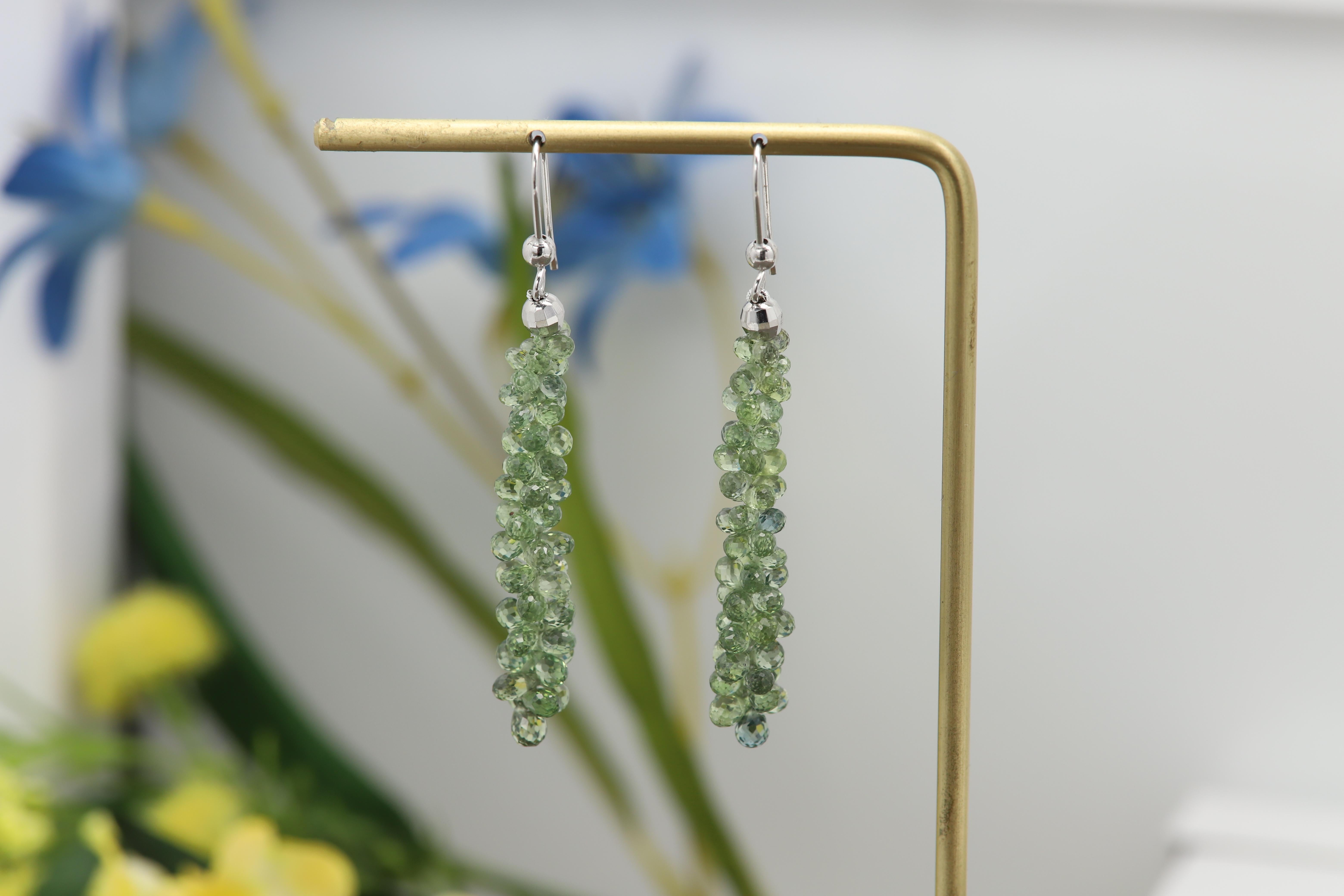 Made in USA
Unique Tear Drop/Briolette Sapphire Earrings
Naturals Gemstones
Natural Green Sapphire
weight is approx 4.0 grams total.
14k White Gold - hook and ball
Approx total size: 2' Inch long 
Sapphire drops alone is approx 1.5' inch
The
