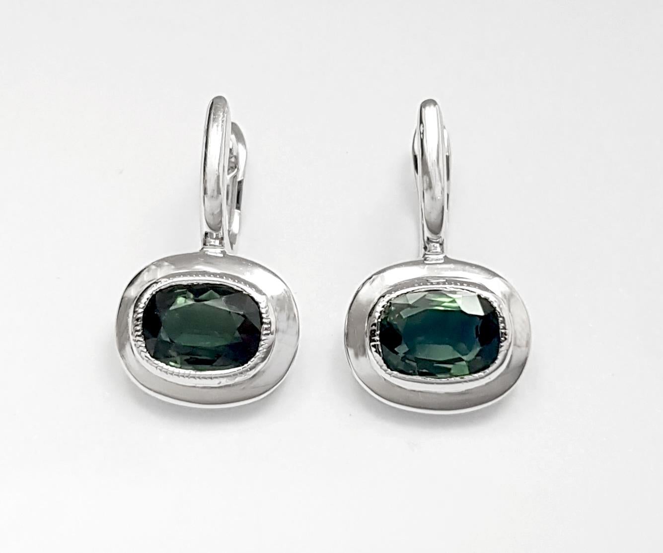 Green Sapphire 2.75 carats Earrings set in 18K White Gold Settings

Width: 1.3 cm 
Length: 2.0 cm
Total Weight: 4.97 grams

