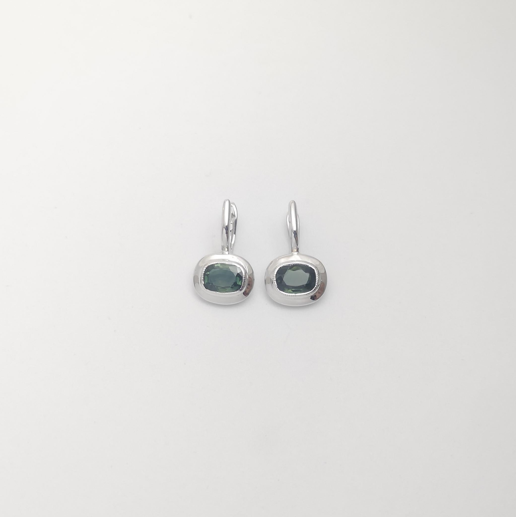 Oval Cut Green Sapphire Earrings set in 18K White Gold Settings For Sale