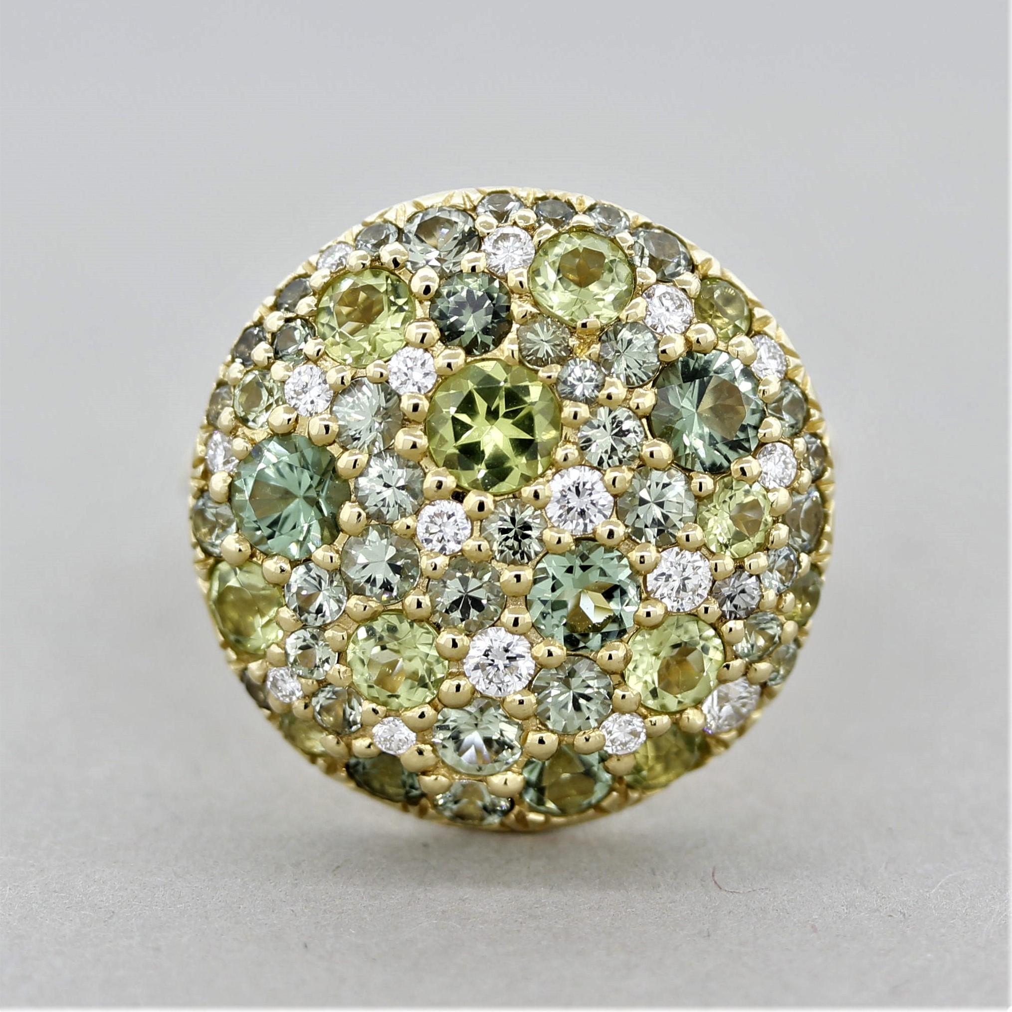 A unique and stylish green ring! It features 3 green gemstones, sapphire, tourmaline and peridot, each with a different shape of green (weights respectively 1.30ctw, 1.22ctw, 0.75ctw). The round-cut green gemstones are accented by bright white