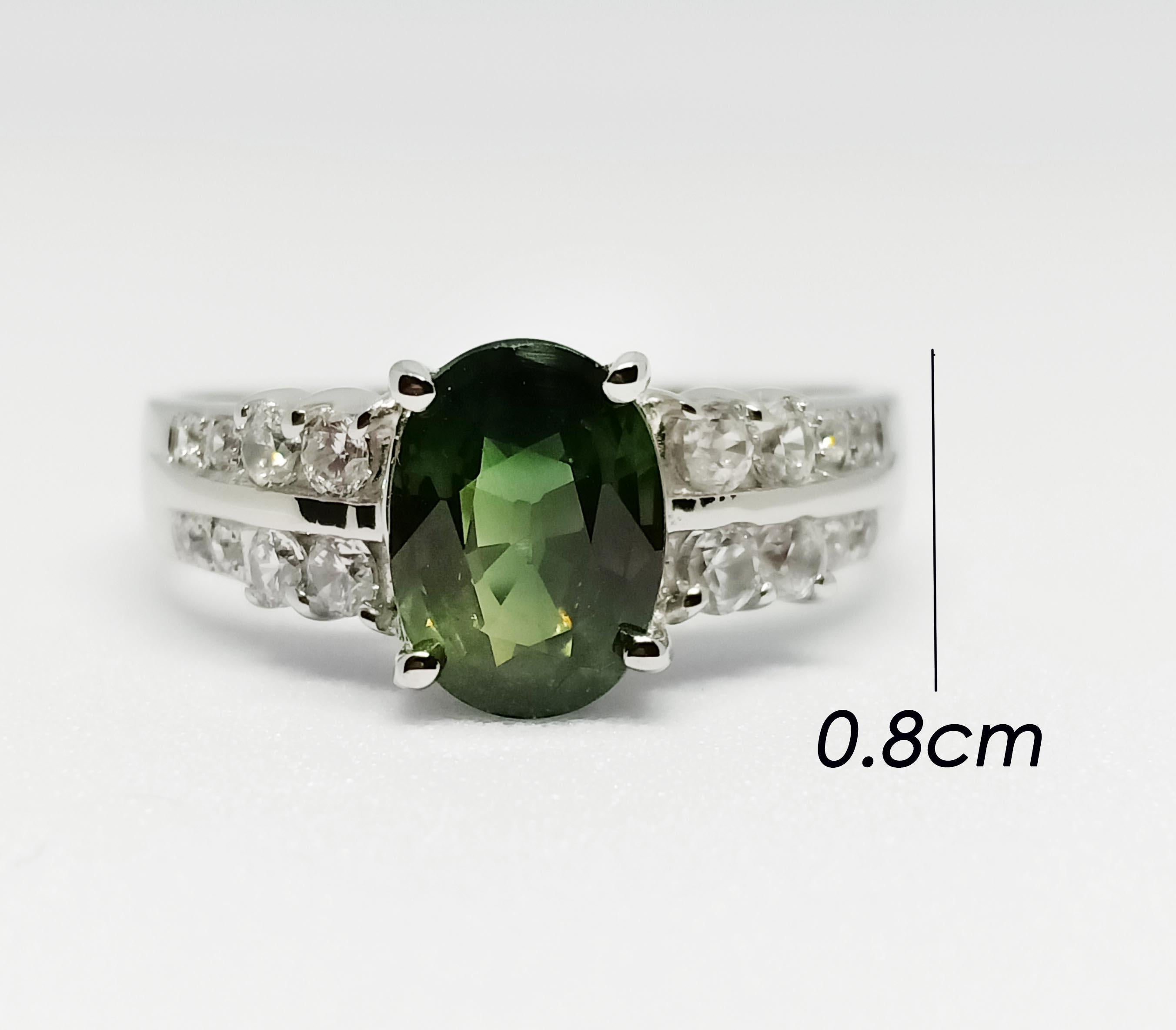Green sapphire (Only Heated) Oval size. 8x6 mm. 1.65 cts
White zircon 2 mm. 8 pcs.
White zircon 1.25 mm. 8 pcs.
18k white gold plated over sterling silver. 

Can be smaller resizable free. take up 7 days before ship.