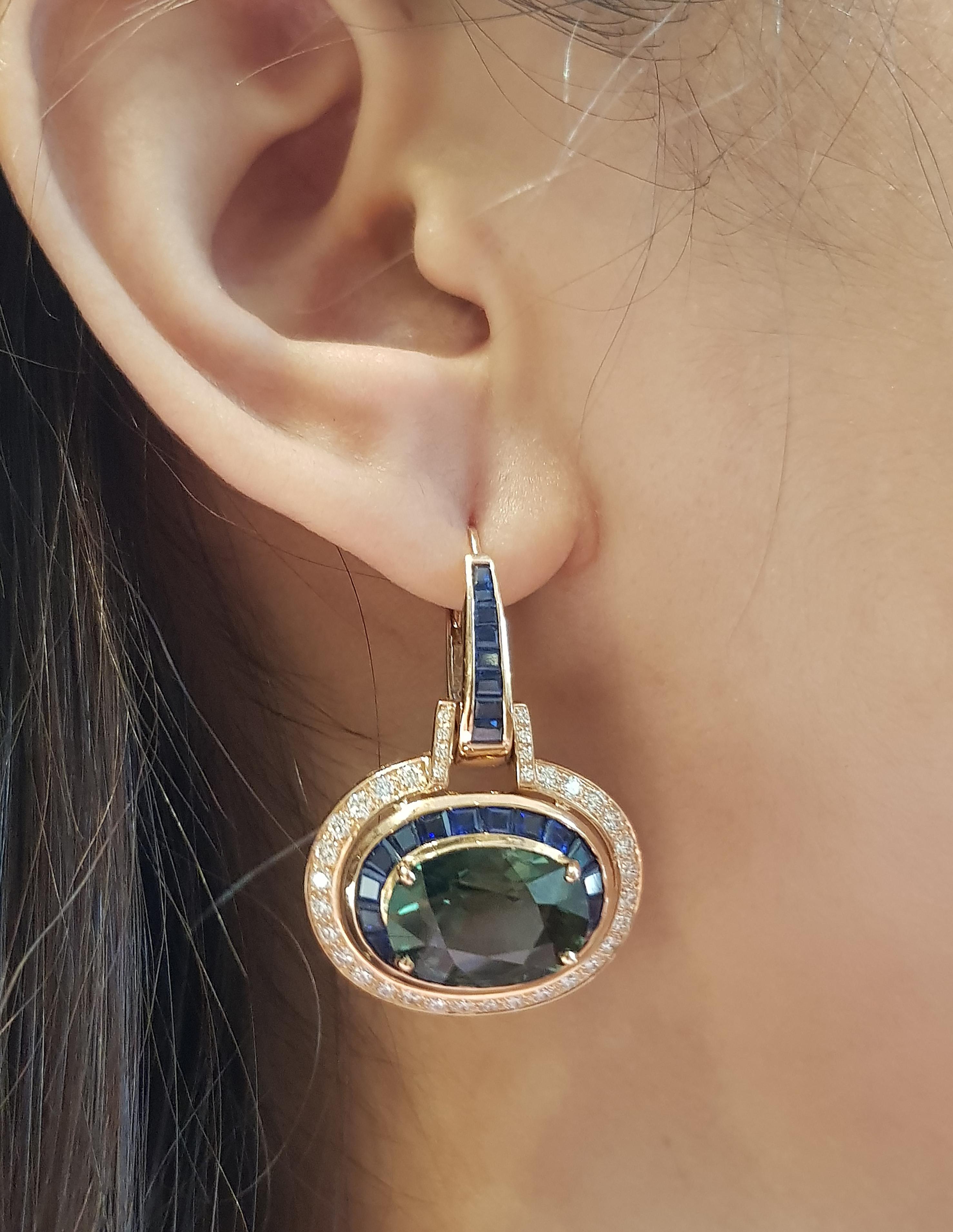 Green Sapphire 18.20 carats with Blue Sapphire 5.23 carats and Diamond 1.23 carats Earrings set in 18 Karat Rose Gold Settings

Width:  2.5 cm 
Length: 3.4 cm
Total Weight: 16.65 grams

