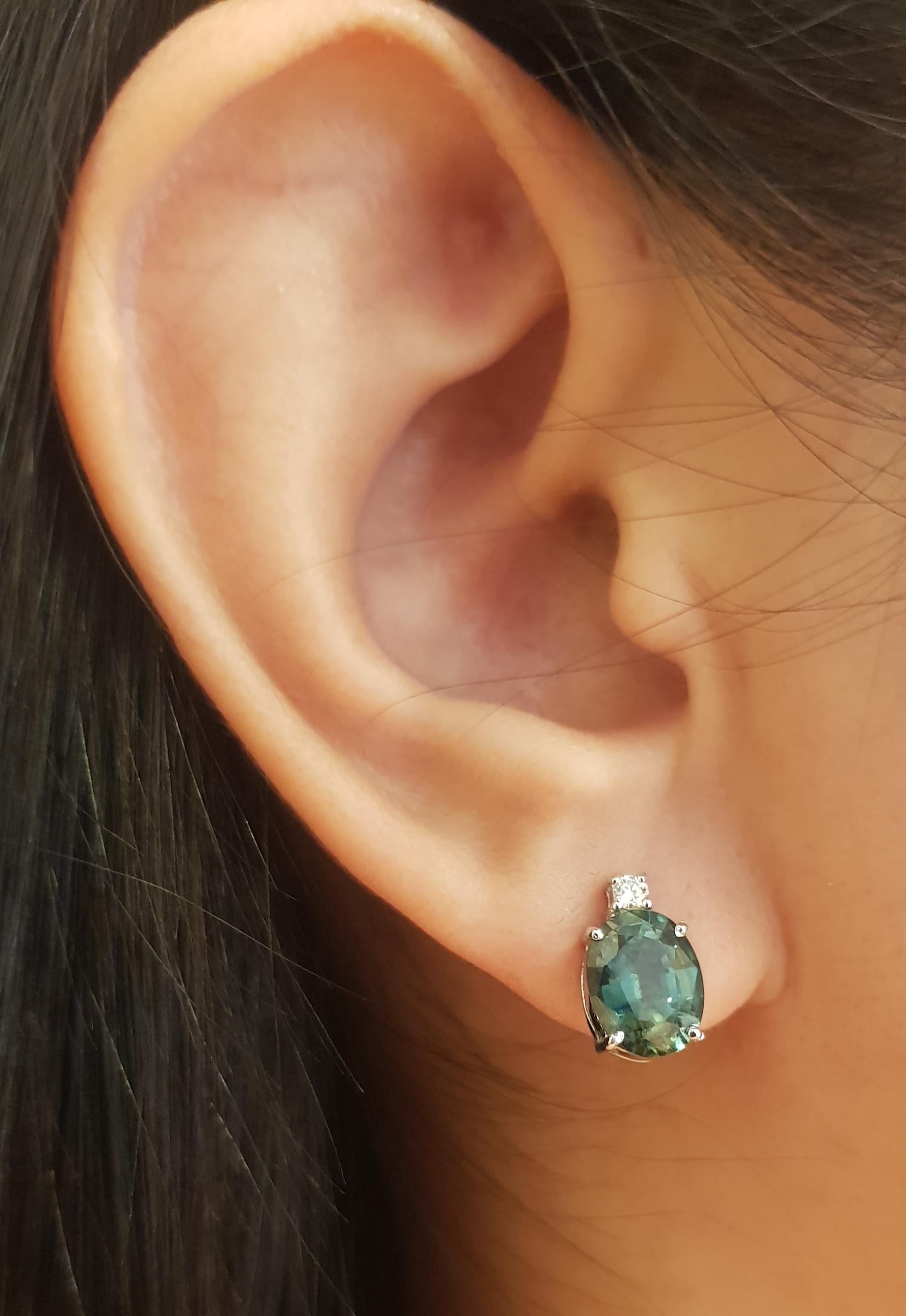 Green Sapphire 4.17 carats with Diamond 0.08 carat Earrings set in 18K White Gold Settings

Width: 0.7 cm 
Length: 1.2 cm
Total Weight: 3.92 grams

