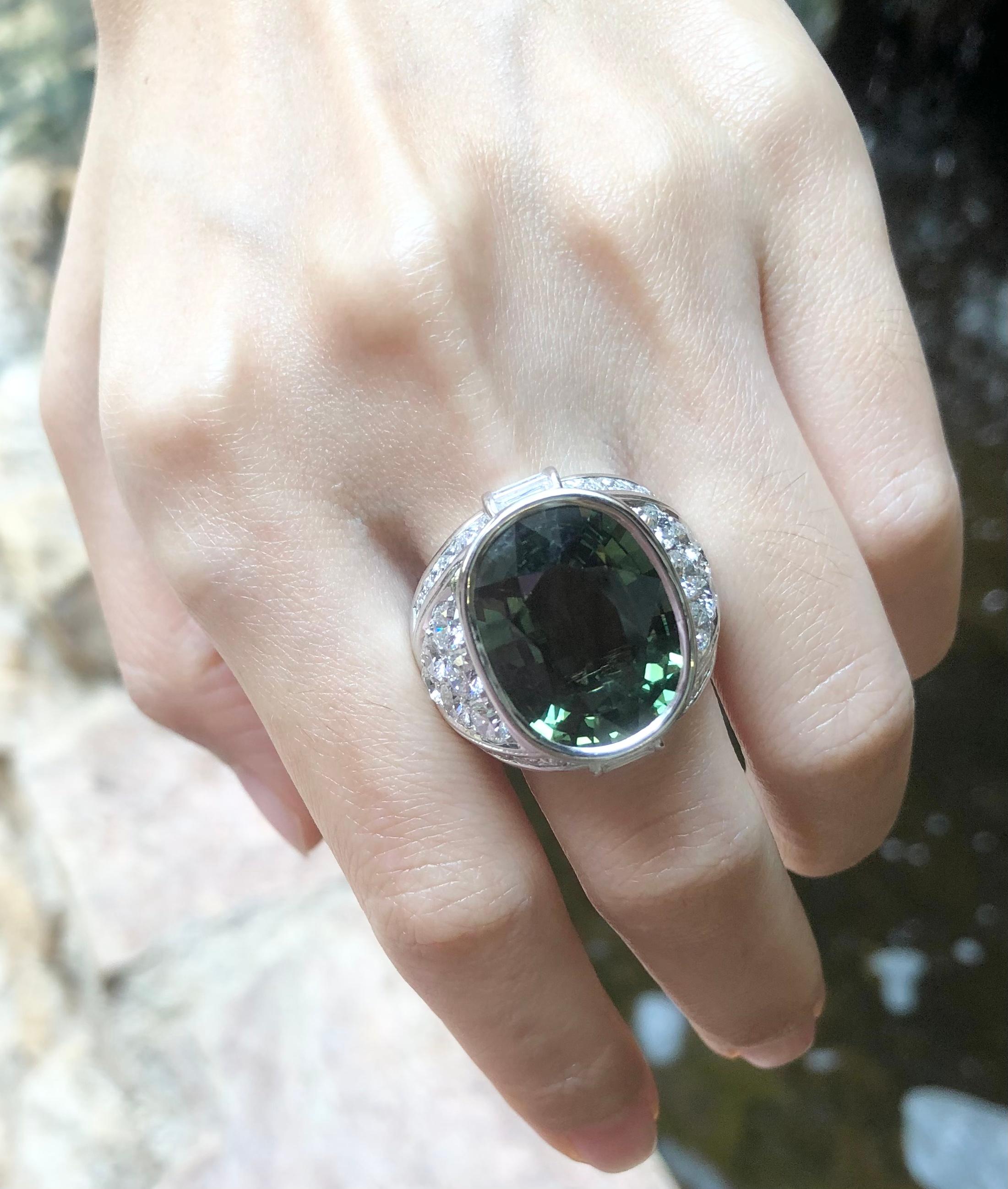 Green Sapphire 16.65 carats with Diamond 5.04 carats Ring set in 18 Karat White Gold Settings

Width:  1.5 cm 
Length: 2.3 cm
Ring Size: 60
Total Weight: 35.2 grams

