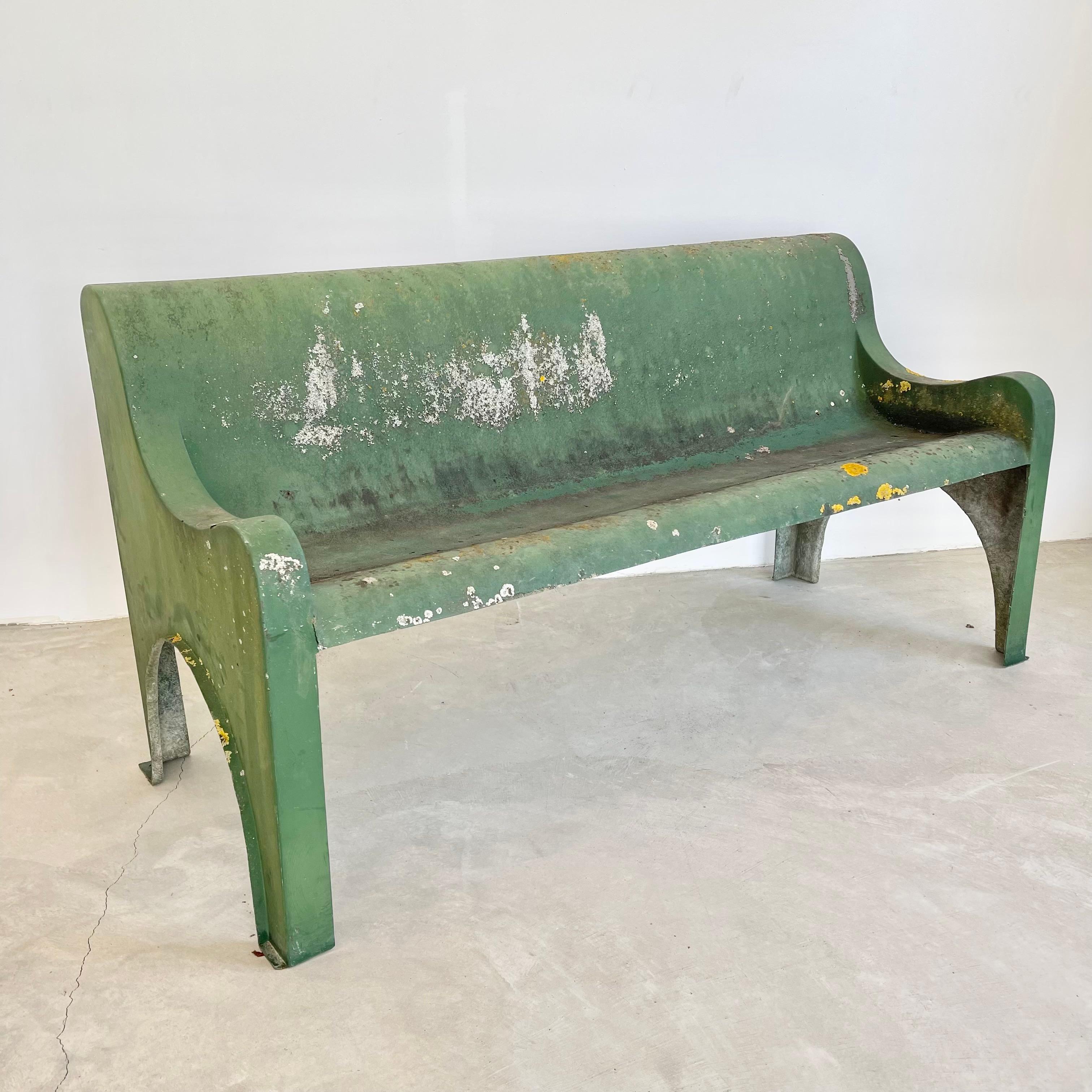 Stunning sculptural green fiberglass bench made in Belgium, circa in the 1970s. Beautiful and simplistic design. Single piece of fiberglass sculpted with great lines from all angles. Made for the outdoors but also looks great inside. Incredible