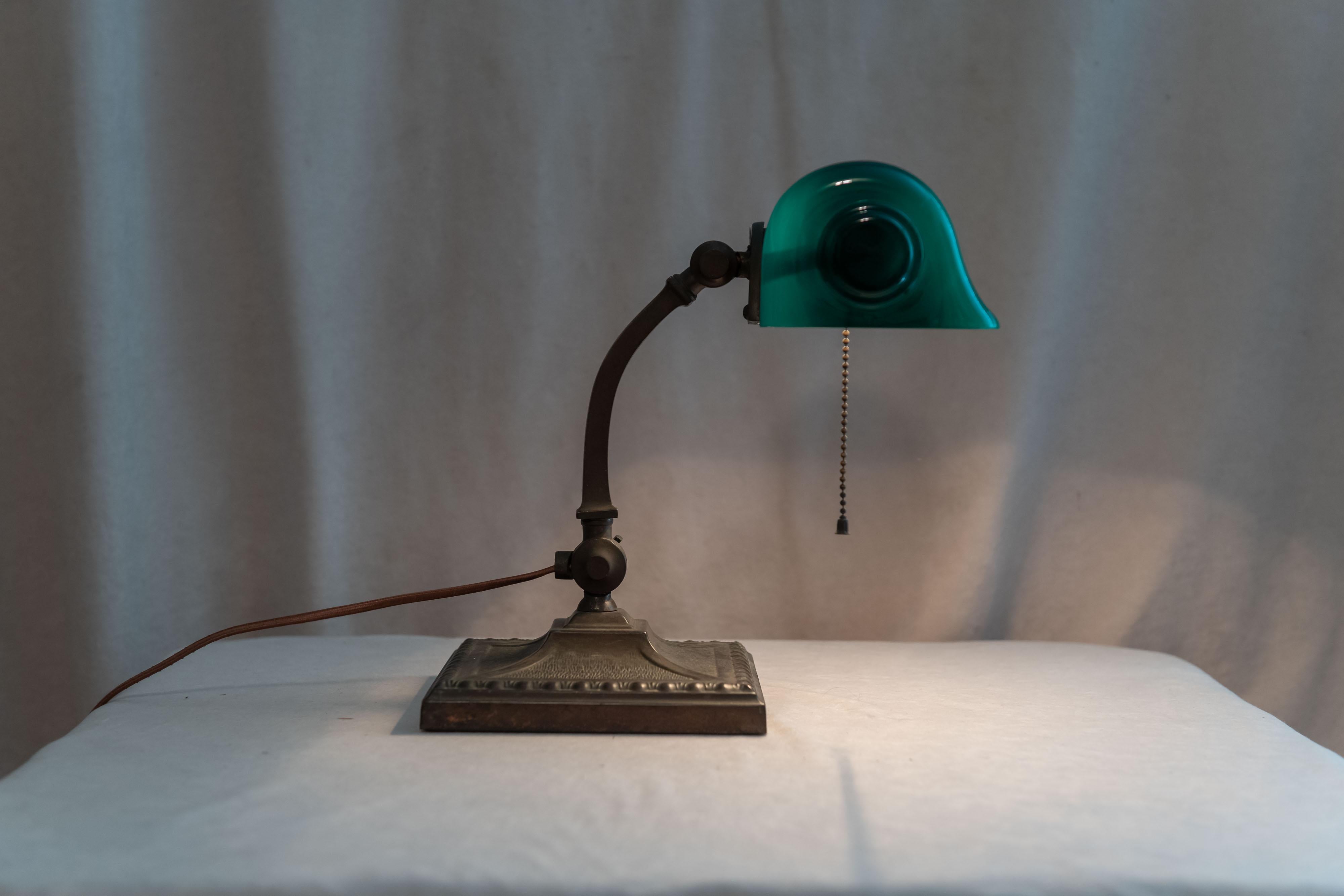 We always on the lookout for these very desirable green shade banker's desk lamps. We believe that the Verdelite Company offers the best example of these, although admittedly Emeralite is the more famous company. The Verdelite shade has those nice