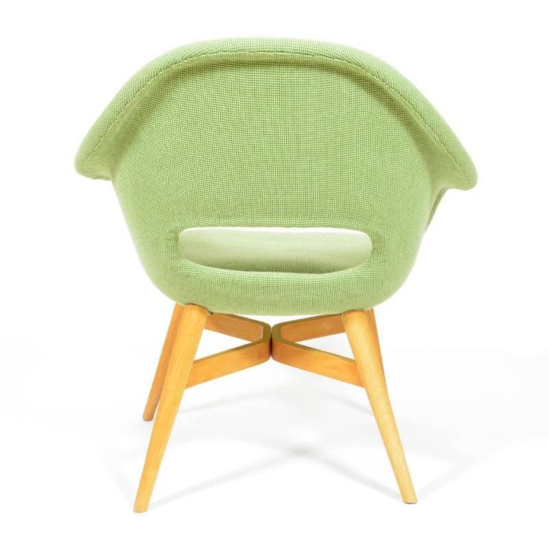Very popular and design valued lounge chair by Miroslav Navrátil. Made of fiberglass shell, with new beautiful green cotton fabric with visible structure. The wooden base made of stained beech is also after renovation and new varnish. Produced in