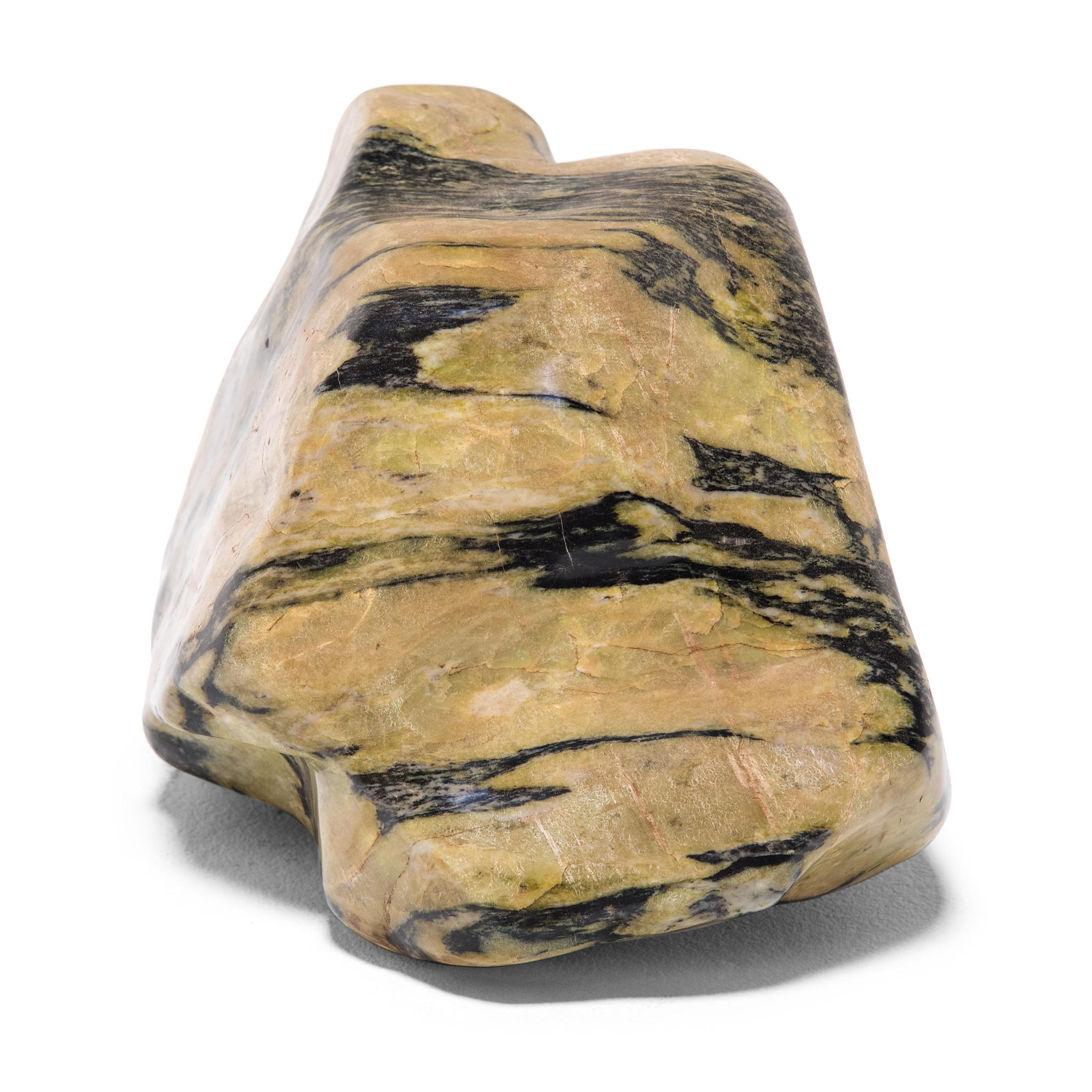 A well-chosen stone is a focal point of both a traditional Chinese garden and a scholar's studio - evoking the complexities of nature and inspiring creative thought. Sourced from China's Dongbei province, this meditation stone has a mesmerizing