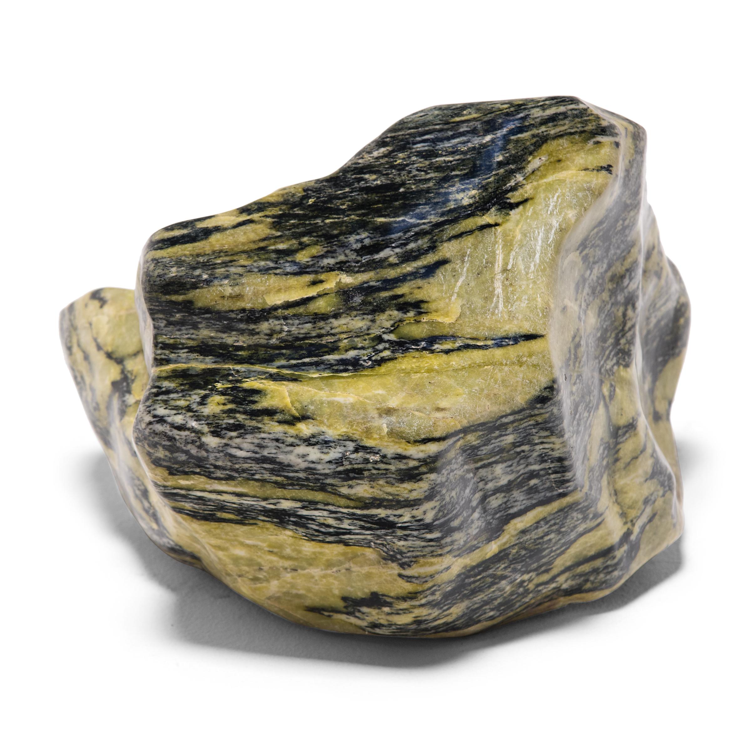 A well-chosen stone is a focal point of both a traditional Chinese garden and a scholar's studio, evoking the complexities of nature and inspiring creative thought. Sourced from China's Dongbei province, this meditation stone has a mesmerizing