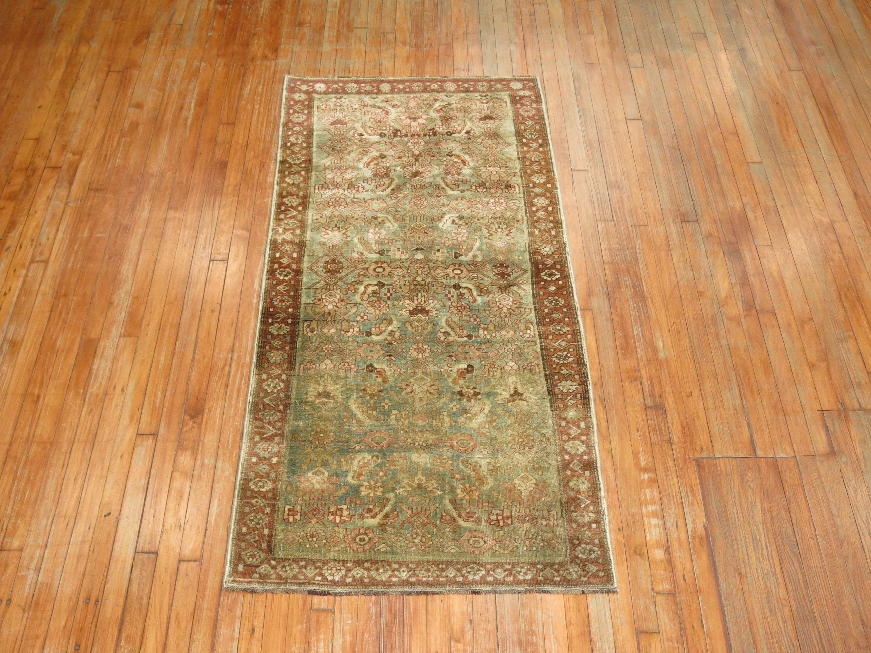 Early 20th century Persian Bidjar rug in green and brown

Measures: 3'3'' x 6'8''.

  