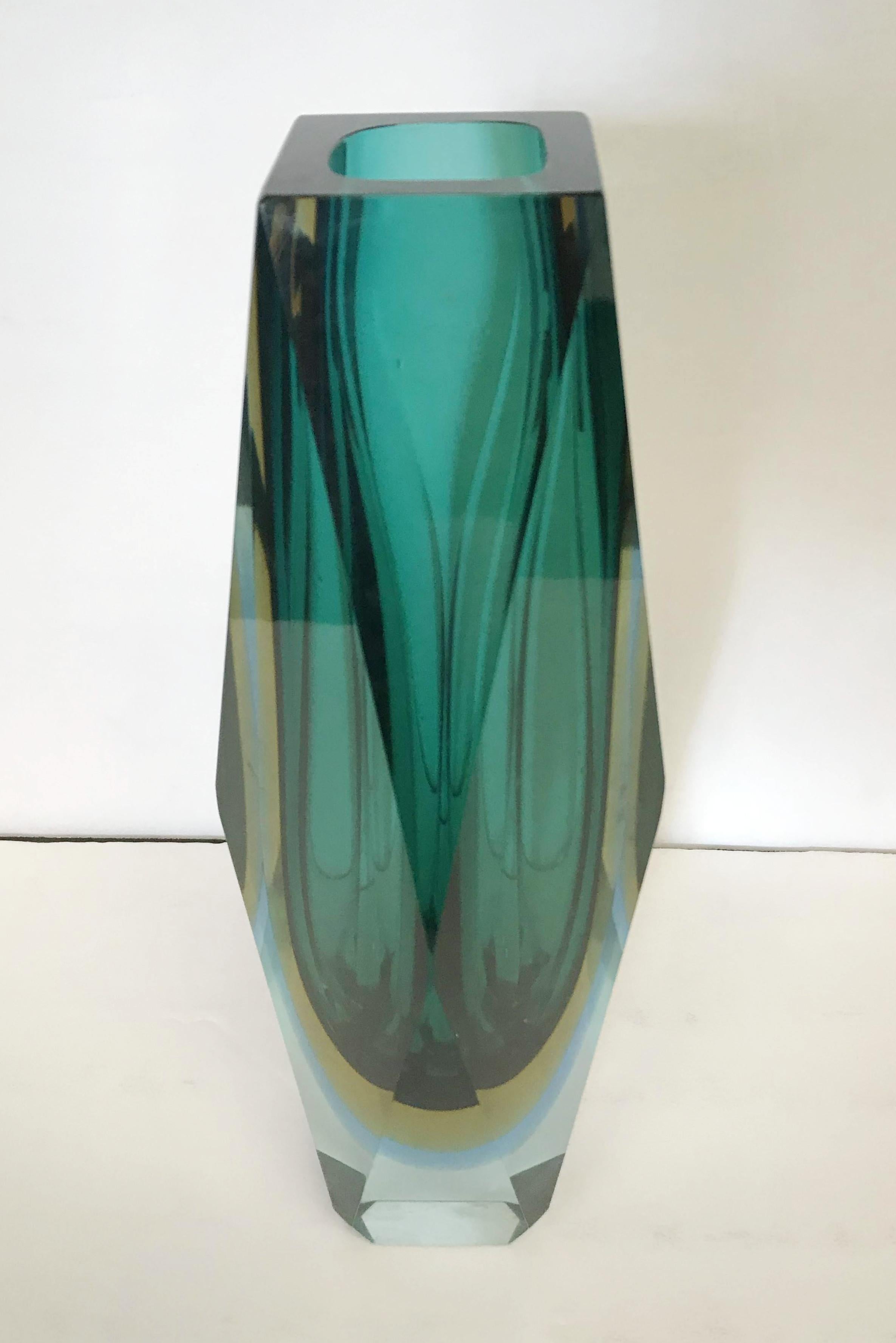 Vintage Italian faceted green Murano glass vase blown in Sommerso technique, designed by Mandruzzato, circa 1960s / Made in Italy
Measures: Height 12 inches, diameter 4.5 inches
* Please note the minor flaw in the glass from the making, shown in the