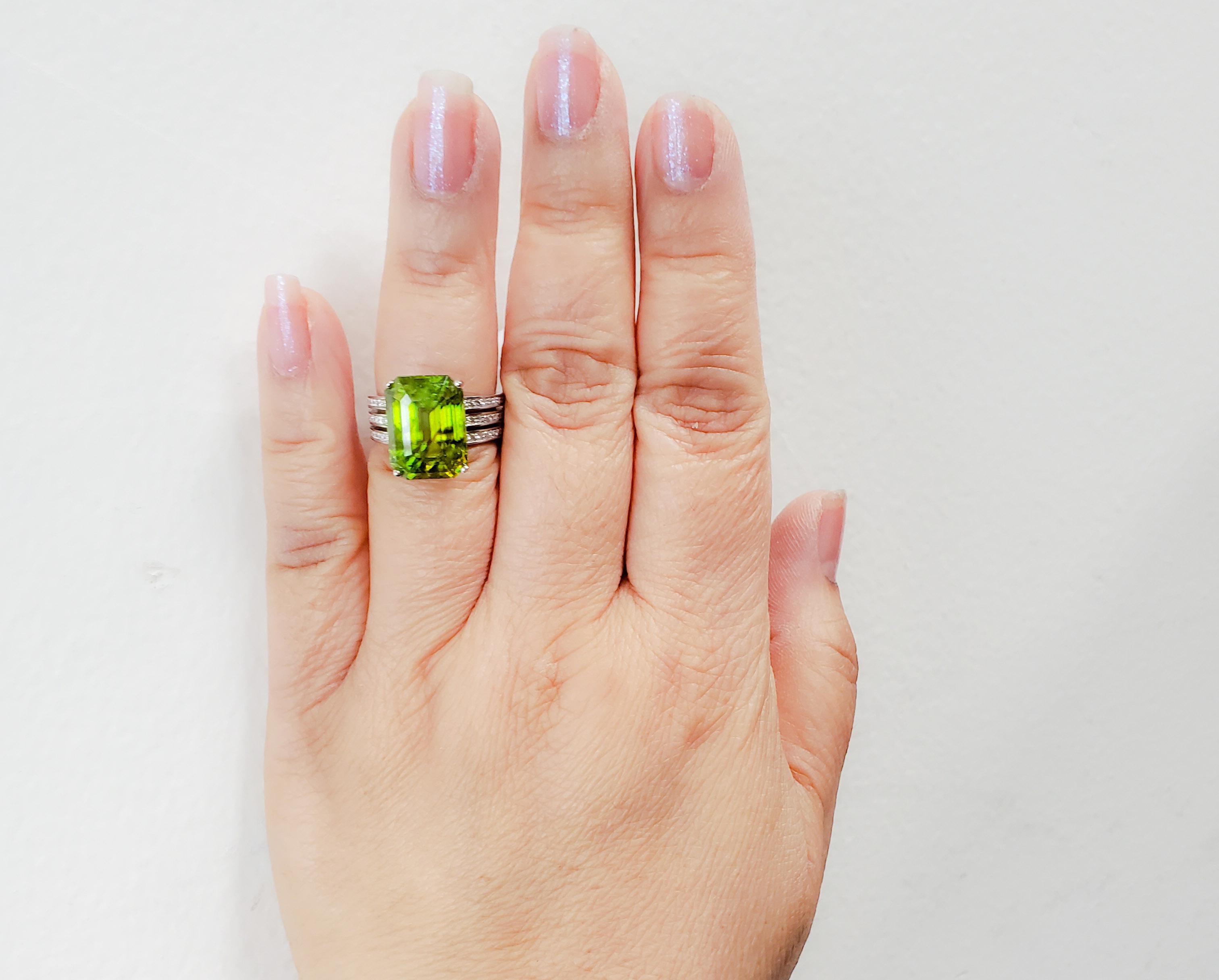 Gorgeous 10.95 ct. green sphene radiant and diamond round cocktail ring.  Handmade in 18k white gold.  Ring size is 6.5.