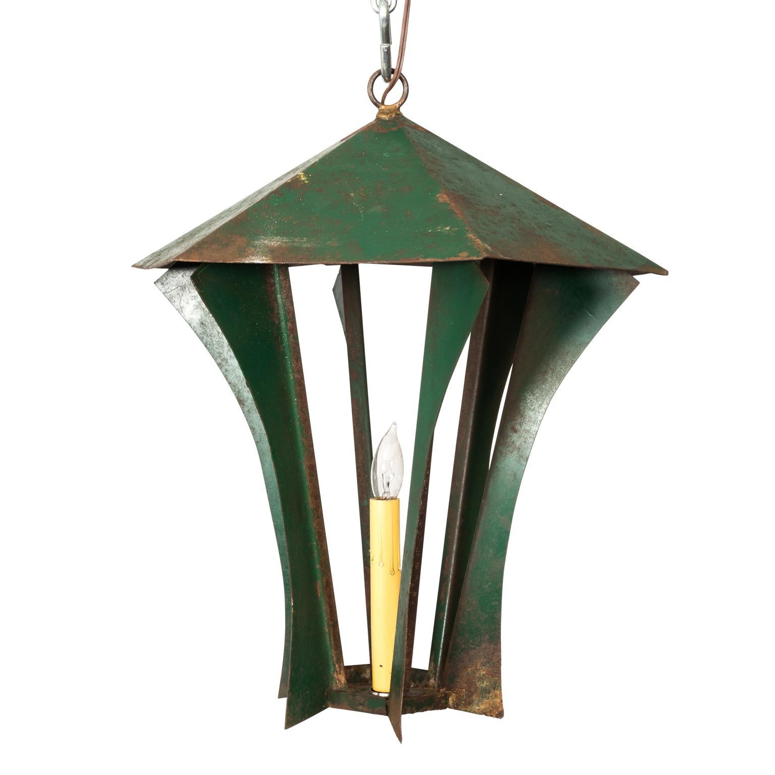 Pair of green painted steel lanterns with minor surface rustication, circa 1940s.