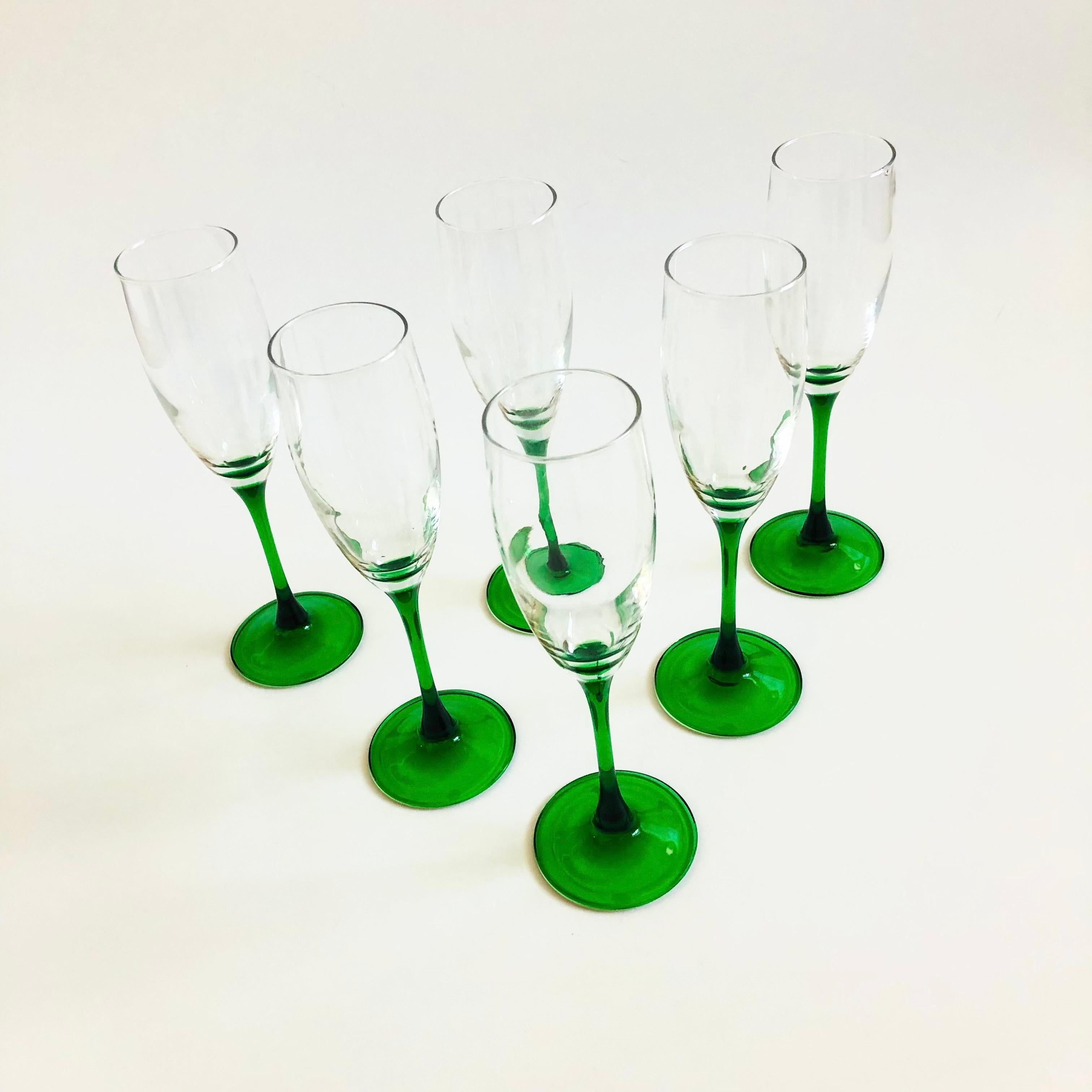 A lovely set of 6 vintage green stemmed champagne flutes. Made in France.

