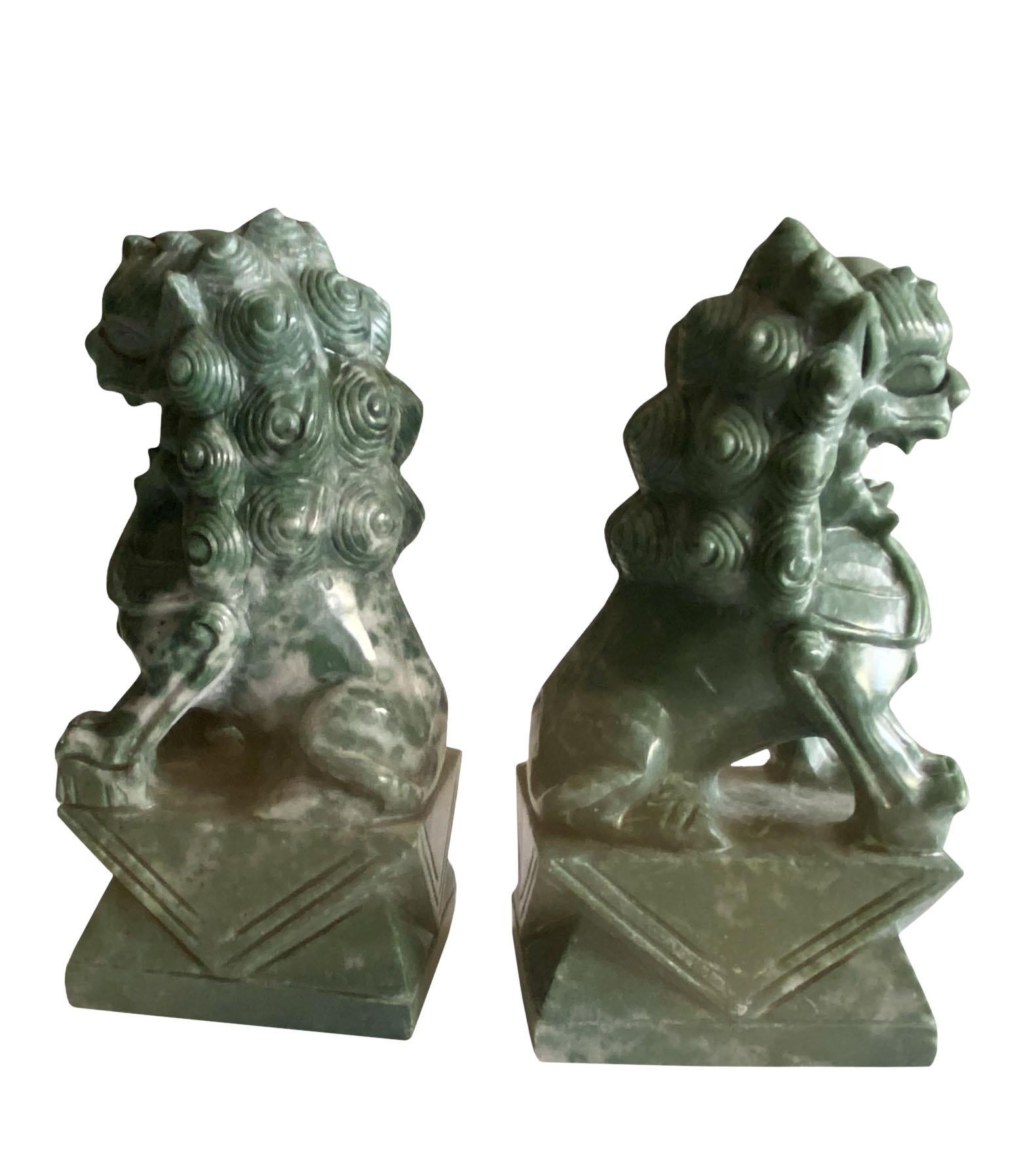 20th Century Green Stone Chinese Foo Dogs, a Pair