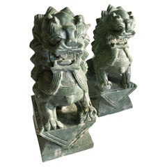 Antique Green Stone Chinese Foo Dogs, a Pair