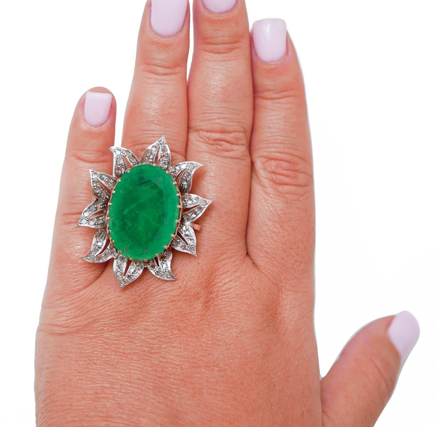 Anello moda in oro rosa 9 kt e struttura in argento montata con una pietra verde centrale circondata da  petali tempestati di diamanti.
Diamanti 0,83 ct
A. Stone 4.70 gr
Peso totale 15.90 gr
RF   *GIHA
RK.AUFF98 
Italiano Taglia 17
Usa Taglia