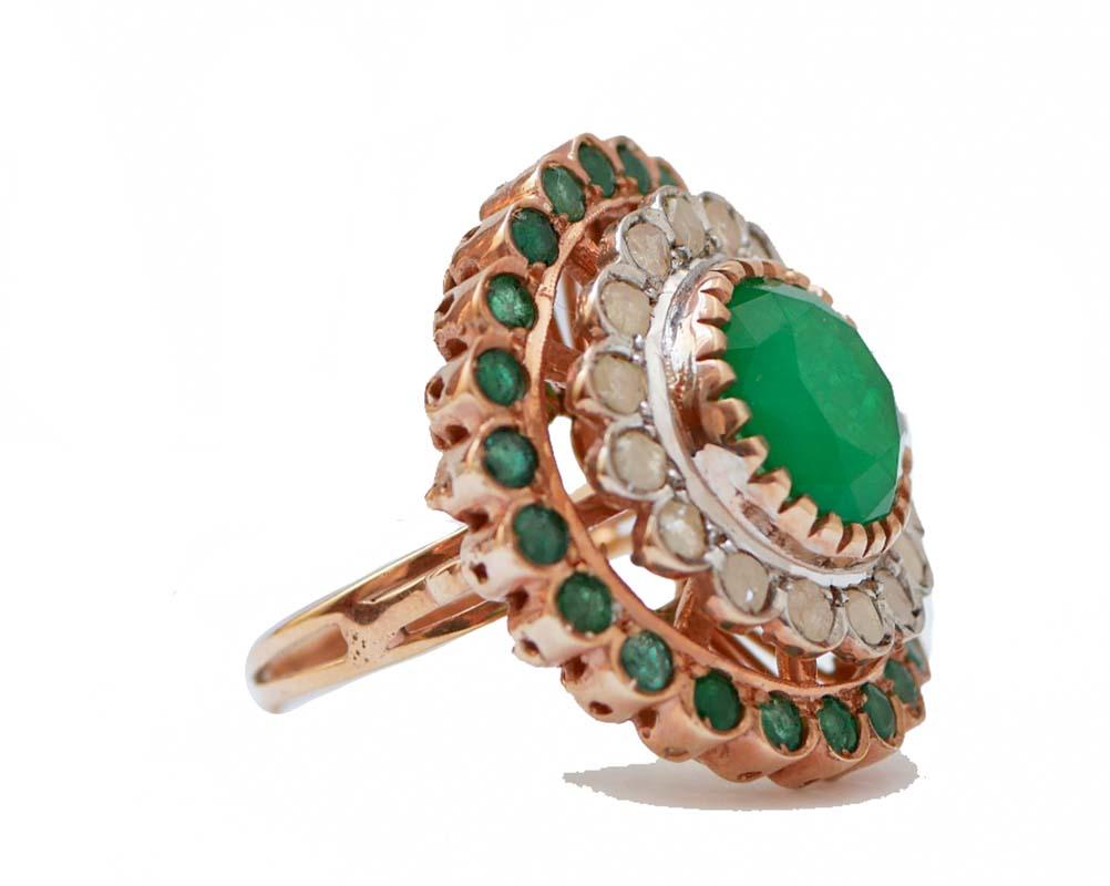 Fantastic ring in 9 kt rose gold and silver structure mounted with a central green stone surrounded by a frame of diamonds and emeralds.
This ring was totally handmade by Italian master goldsmiths and it is in perfect conditions.
Diamonds 1.19