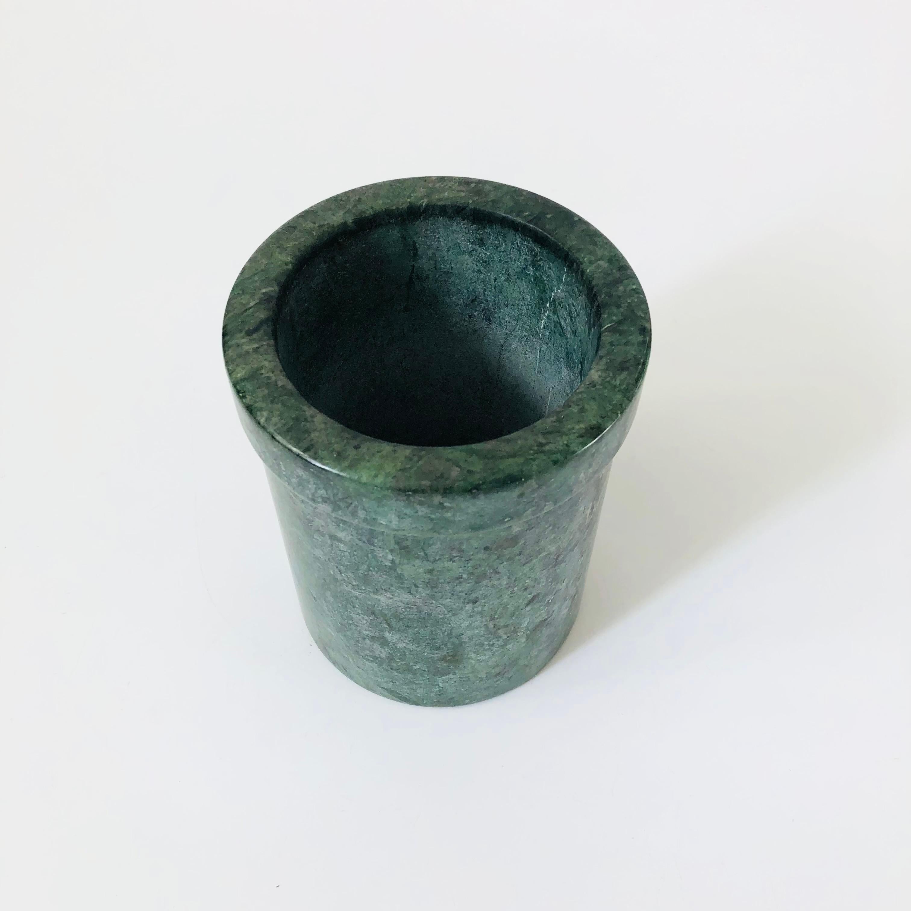 A vintage stone vessel. Nice modern cylinder shape. Beautiful muted dark green color with lovely natural variation to the stone. Perfect for using as a utensil holder in the kitchen or could be used as a vase.

