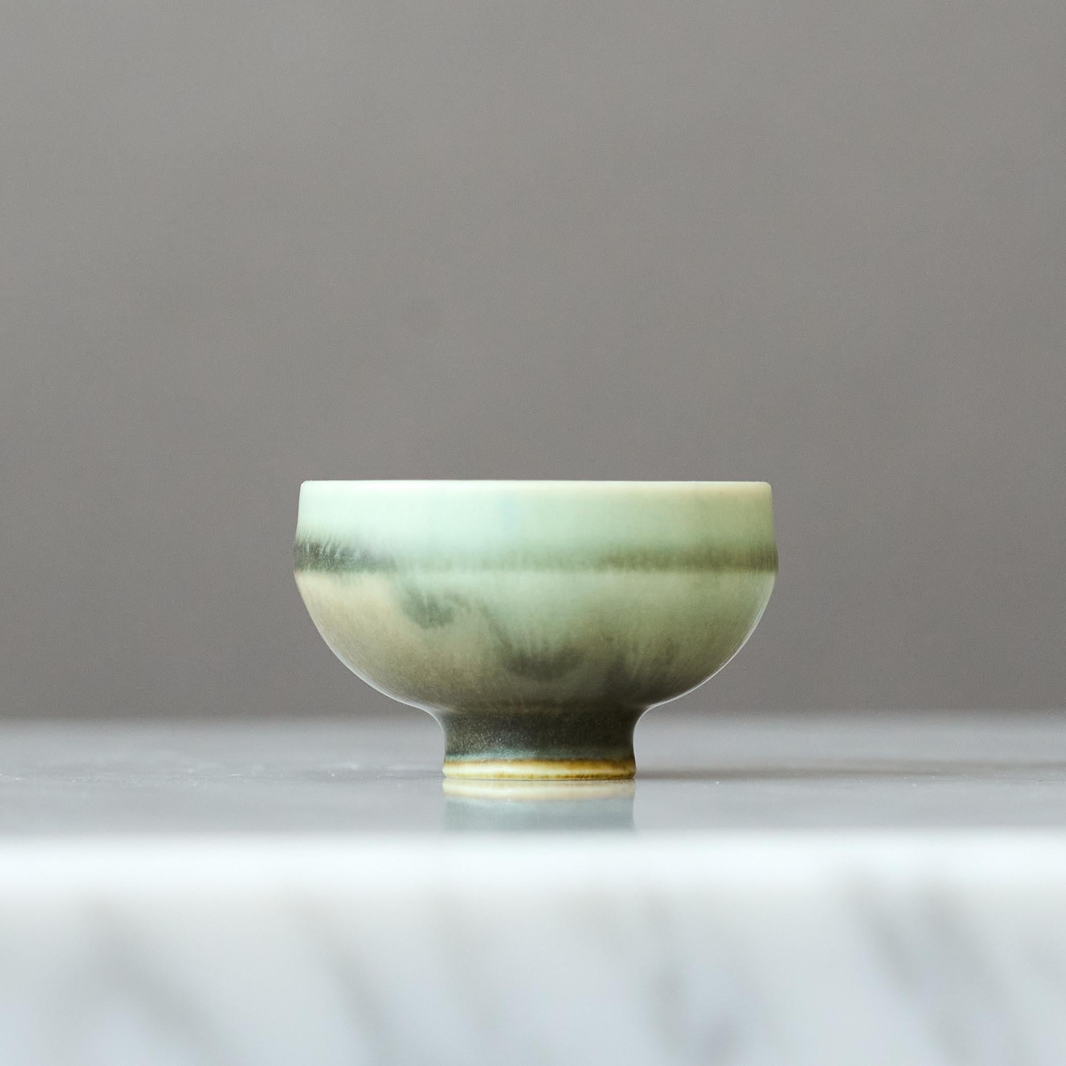 A beautiful miniature stoneware bowl with amazing green hare’s fur glaze.
Made by master thrower Berndt Friberg, in the artist's studio at Gustavsberg, Sweden, 1960s.

Great condition. 
Incised signature 'Friberg' and Gustavsberg studio