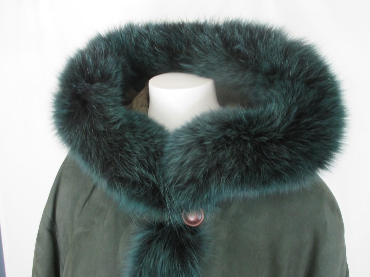 Green suede exterior and fabric interior warm wide vintage coat with attached hood and fox fur 

We offer more exclusive lambskin, shearling and fur items, see our frontstore

Details:
With 2 pockets, 5 buttons, closing cord at bottom
Lining 60%