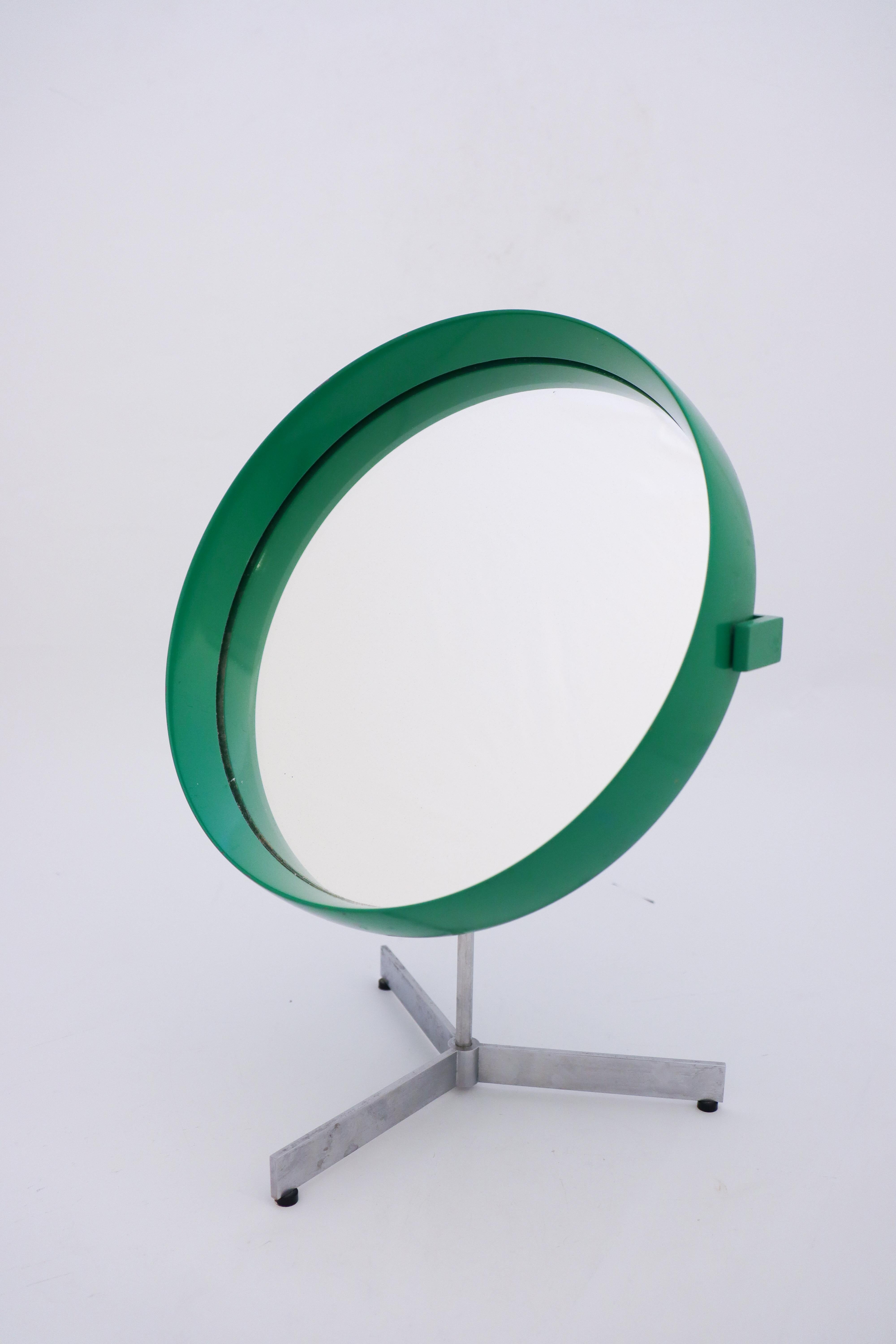 A lovely green table mirror designed by Uno & Östen Kristiansson. Produced by Luxus in Vittsjö, Sweden in the 1960s. Base in brushed aluminum. It is adjustable in angle and swiveling. It is in very good condition except from some dust between the