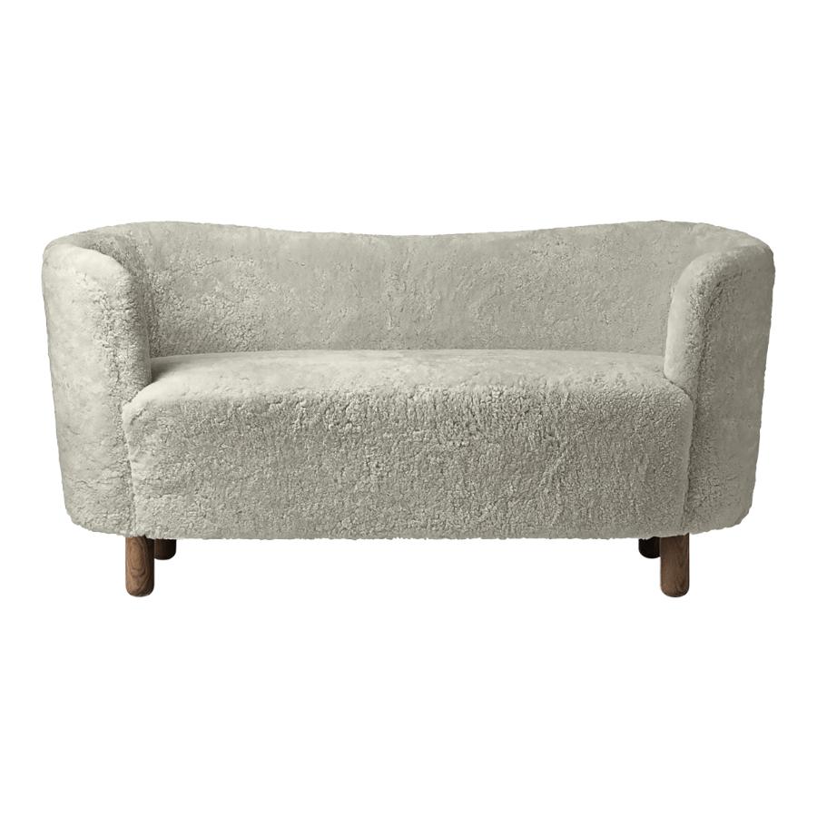 Green tea sheepskin and smoked oak mingle sofa by Lassen
Dimensions: W 154 x D 68 x H 74 cm 
Materials: Sheepskin, Oak.

The Mingle sofa was designed in 1935 by architect Flemming Lassen (1902-1984) and was presented at The Copenhagen