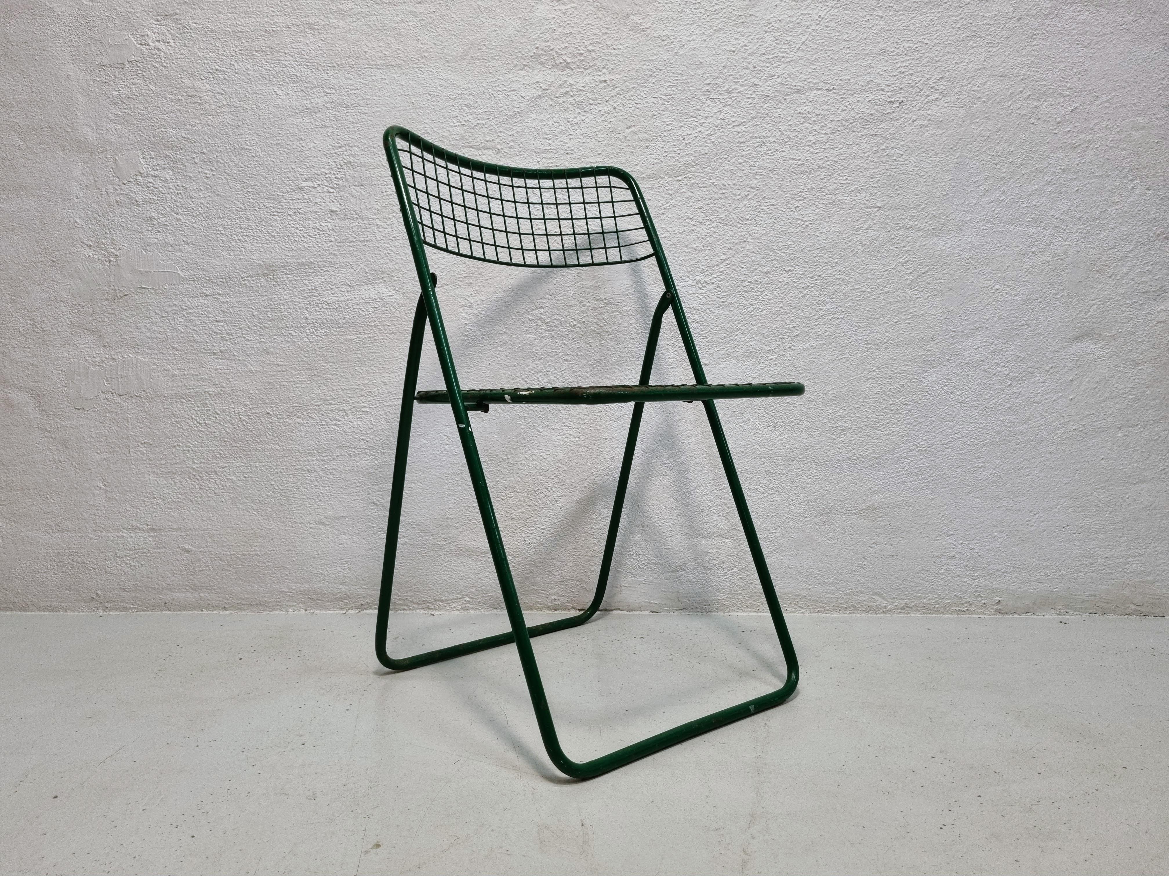Green metal folding chair. 
This chair was designed by Niels Gammelgaard for Ikea in the 1970s. 
This chair appears with the original green paint in patinated condition, which gives it a slightly rough look.