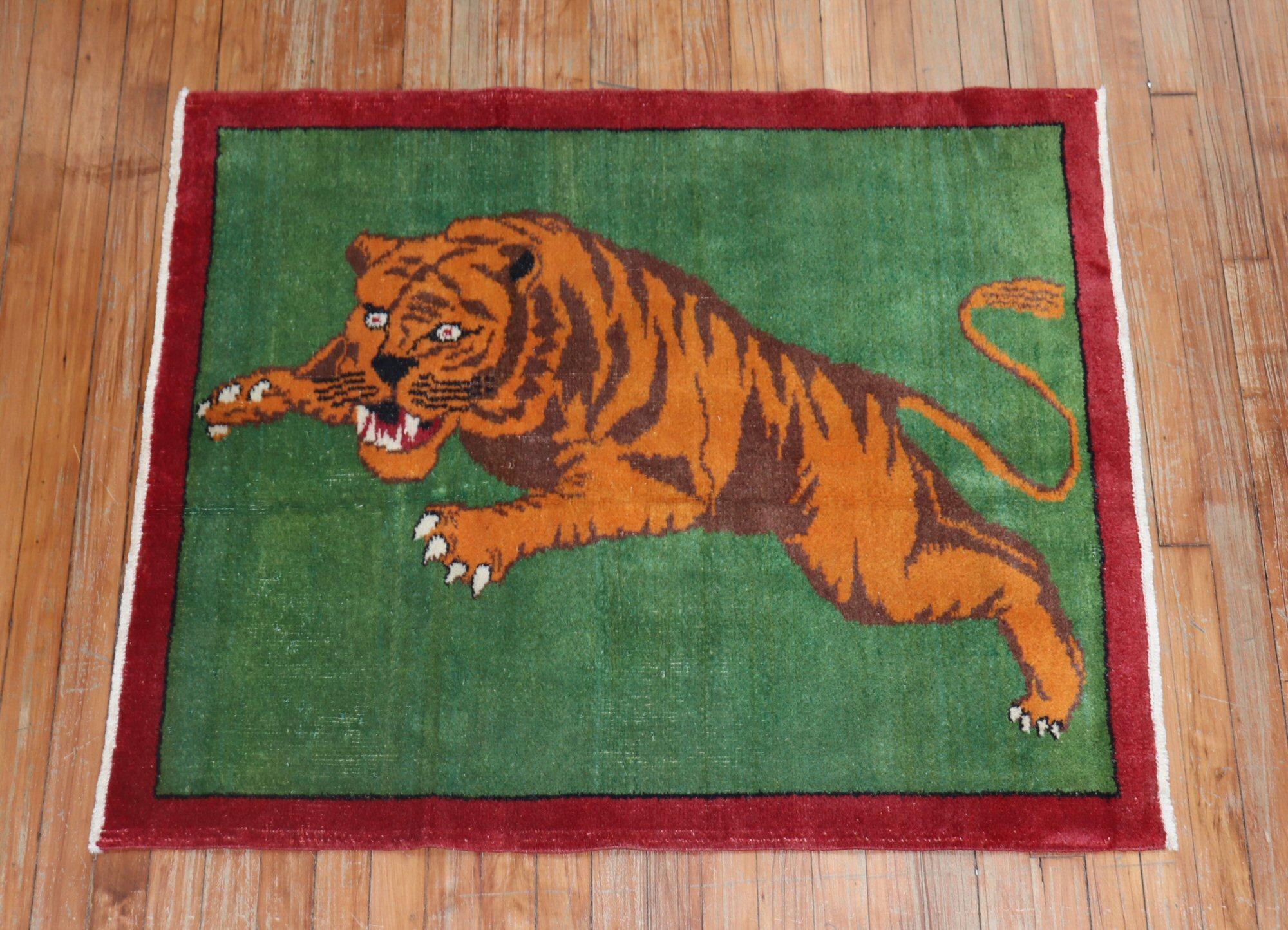 One of a kind, mid 20th-century Hand-knotted Turkish Anatolian rug with a large roaring tiger on a solid green field. RAAARRRR!

3'3'' x 3'9''