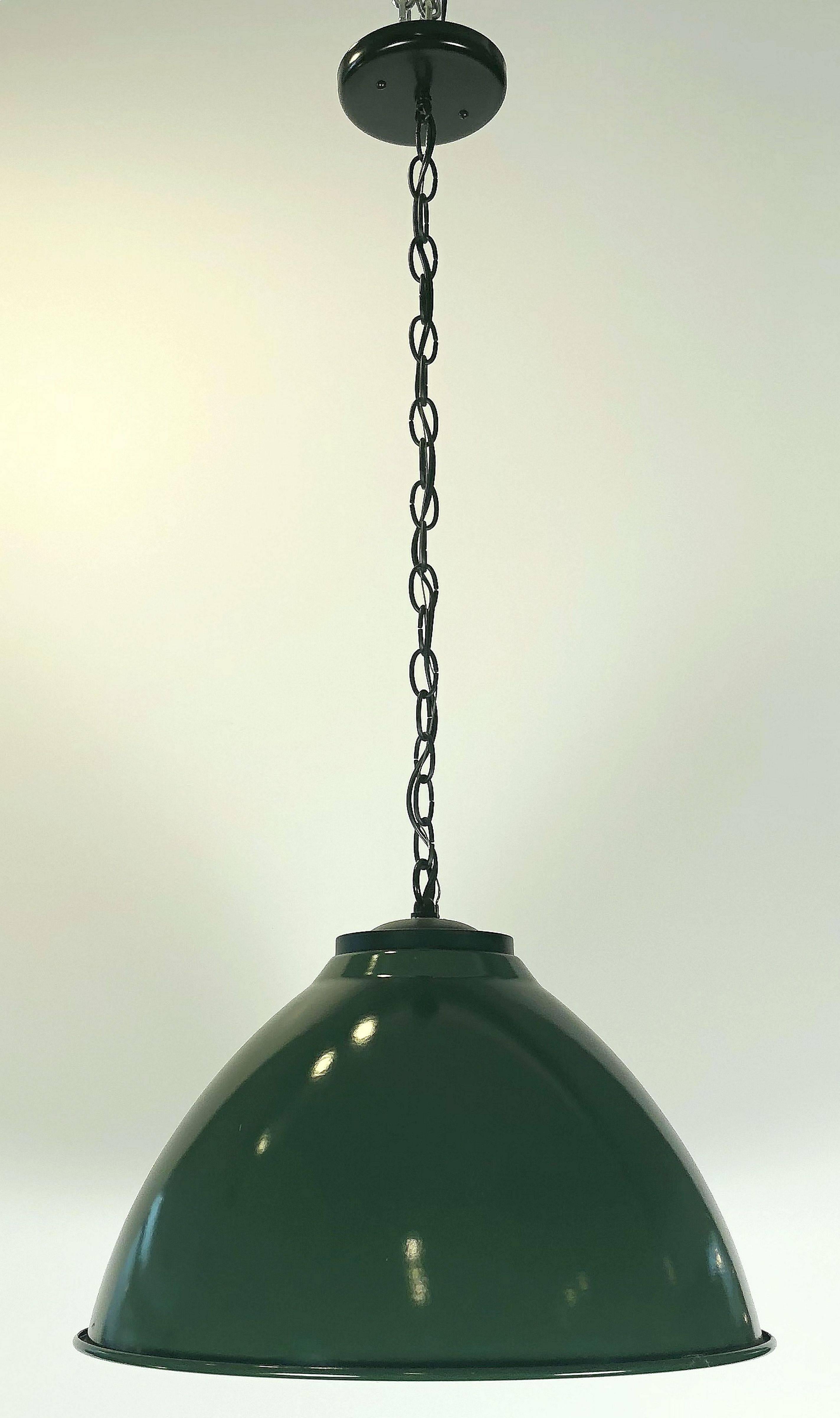 Two green enameled tole industrial hanging (fixture) lamps or lanterns from England, each one featuring a factory sized dome metal shade. 
Makes for a unique vintage machine style or modernist chandelier. 

Measures: Diameter 18 1/4 inches

U.S.