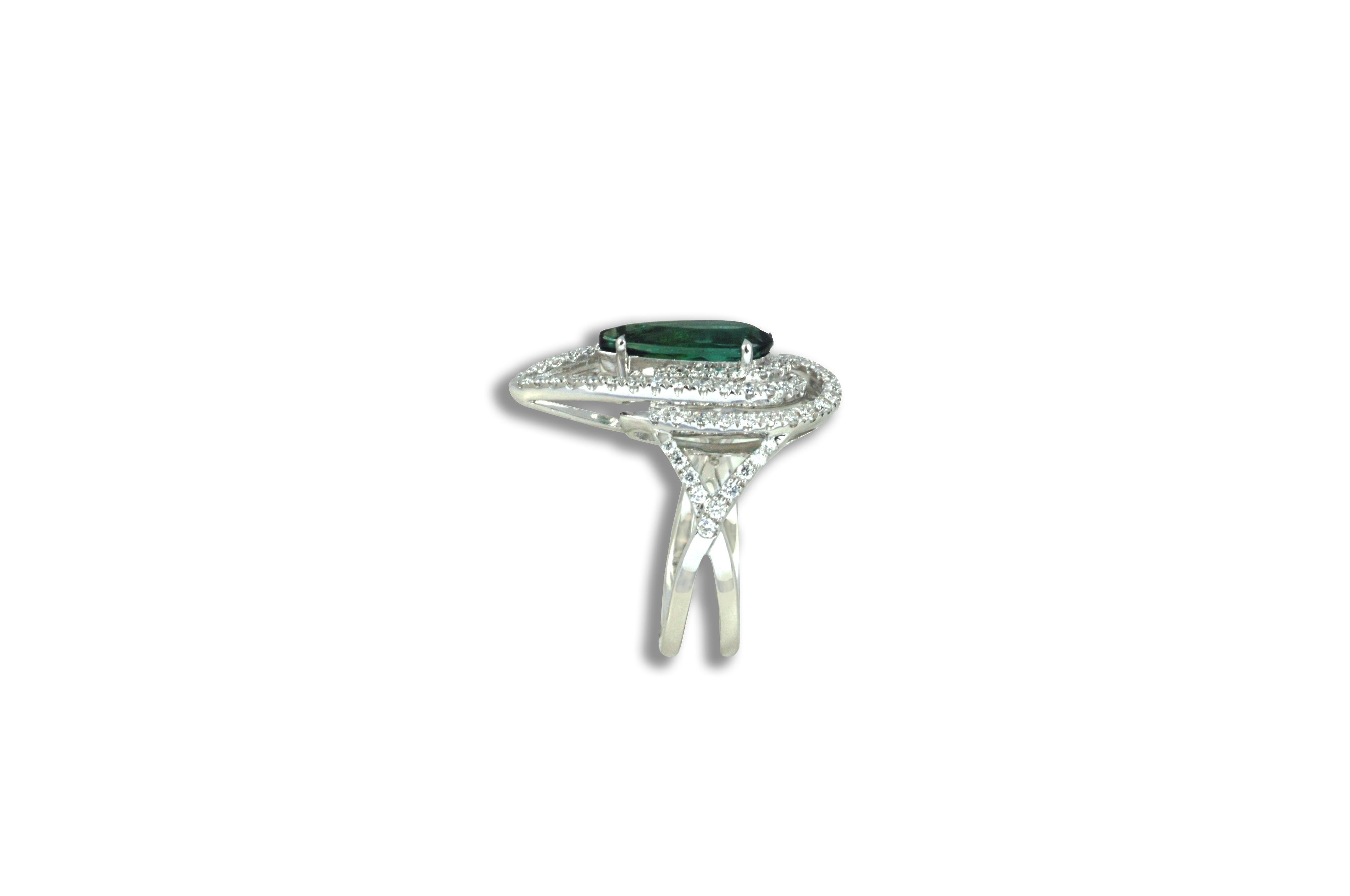 Green Tourmaline 1.45 carats with Diamond 0.62 carat Ring in 18 karat White Gold Settings

Width: 1.7 cm
Length: 2.3 cm
Ring Size: 52
Total Weight: 7.55 grams

