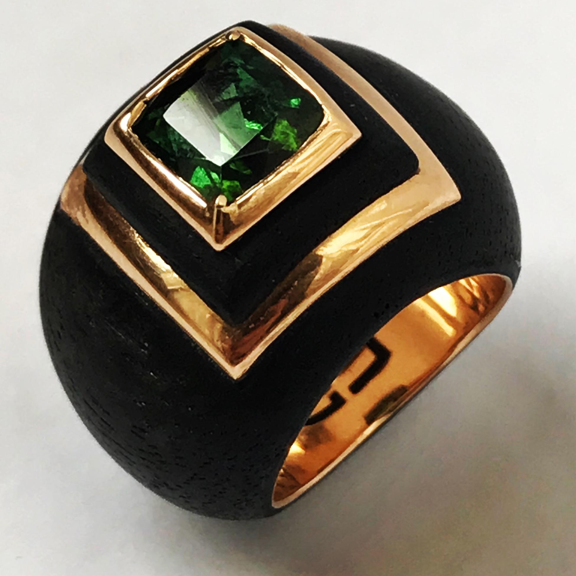 Green tourmaline, 18K rose gold and ebony pinky ring by Frederique Berman.
Ebony and rose gold dome ring, set with a 2.12 carat emerald cut green tourmaline.
Inspired by 