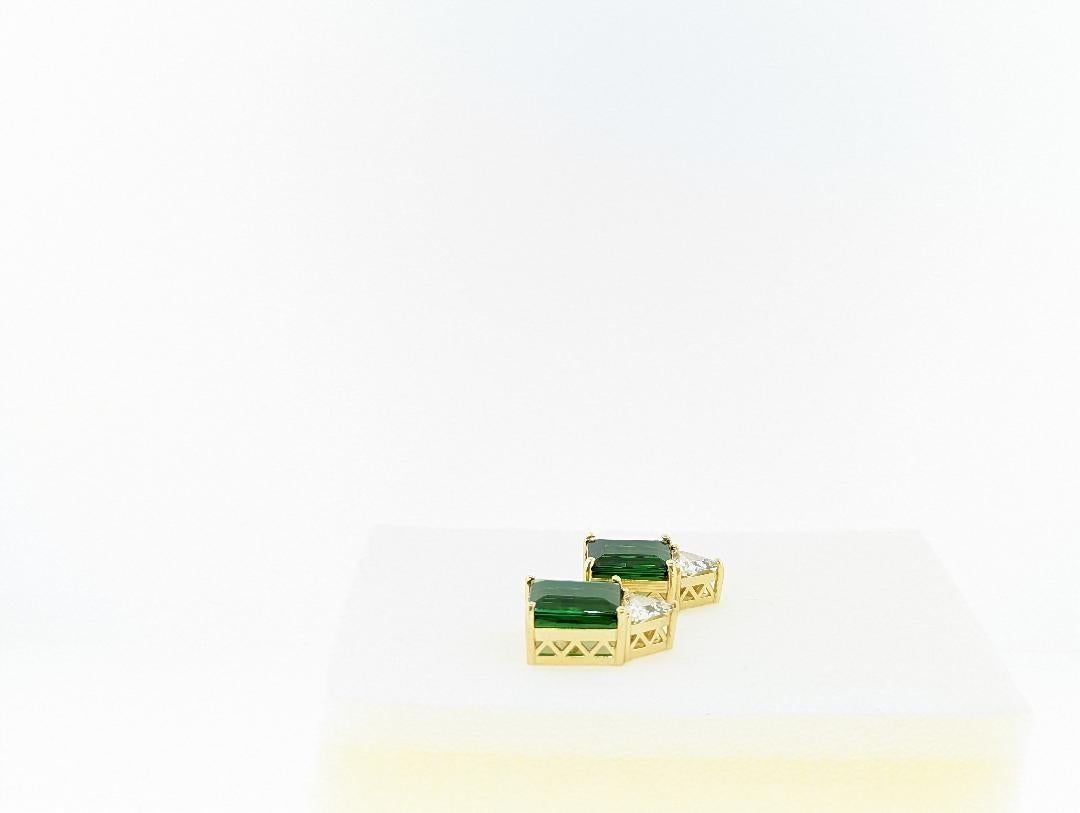 Using material from the mines of Afghanistan, the lively and rich pair of rectangular tourmalines exhibit a warming shade of green.  Unusually clean on the inside, the tourmalines were cut in our workshops by our master cutter in Idar Oberstein,
